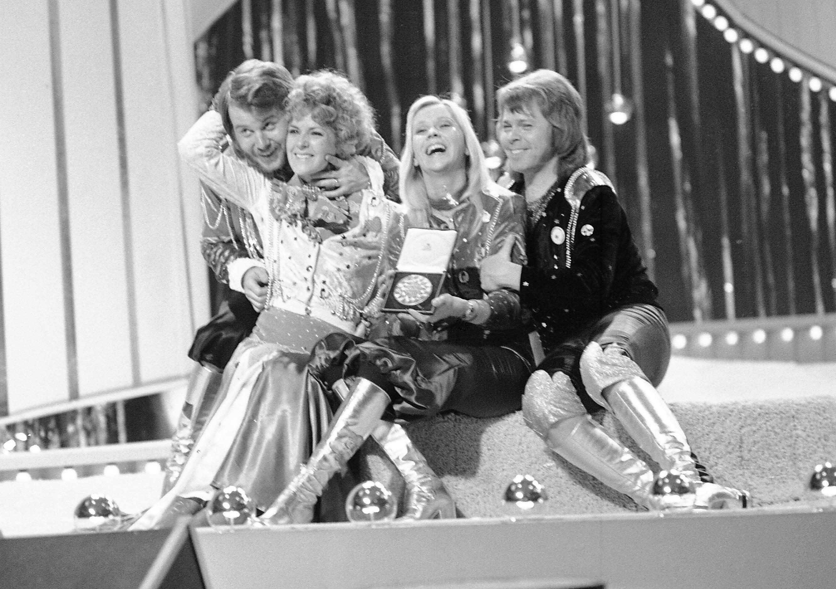 FILE - In this April 6, 1974 file photo, Swedish pop group ABBA celebrate winning the 1974 Eurovision Song Contest on stage at the Brighton Dome in England with their song Waterloo. The coronavirus pandemic canceled the contest in 2020 for the first time in six decades, but now it’s back. On Saturday performers from 26 countries will vie for Eurovision victory in a live televised final in the Dutch city of Rotterdam. The prize is glory for the winning nation, though rarely mega-stardom for the victorious act. A few international stars have emerged from Eurovision’s sequinned ranks, including Swedish pop titans ABBA — victors in 1974 with “Waterloo” — and Canadian chanteuse Celine Dion, who won the 1988 contest for Switzerland.(AP Photo/Robert Dear, File)