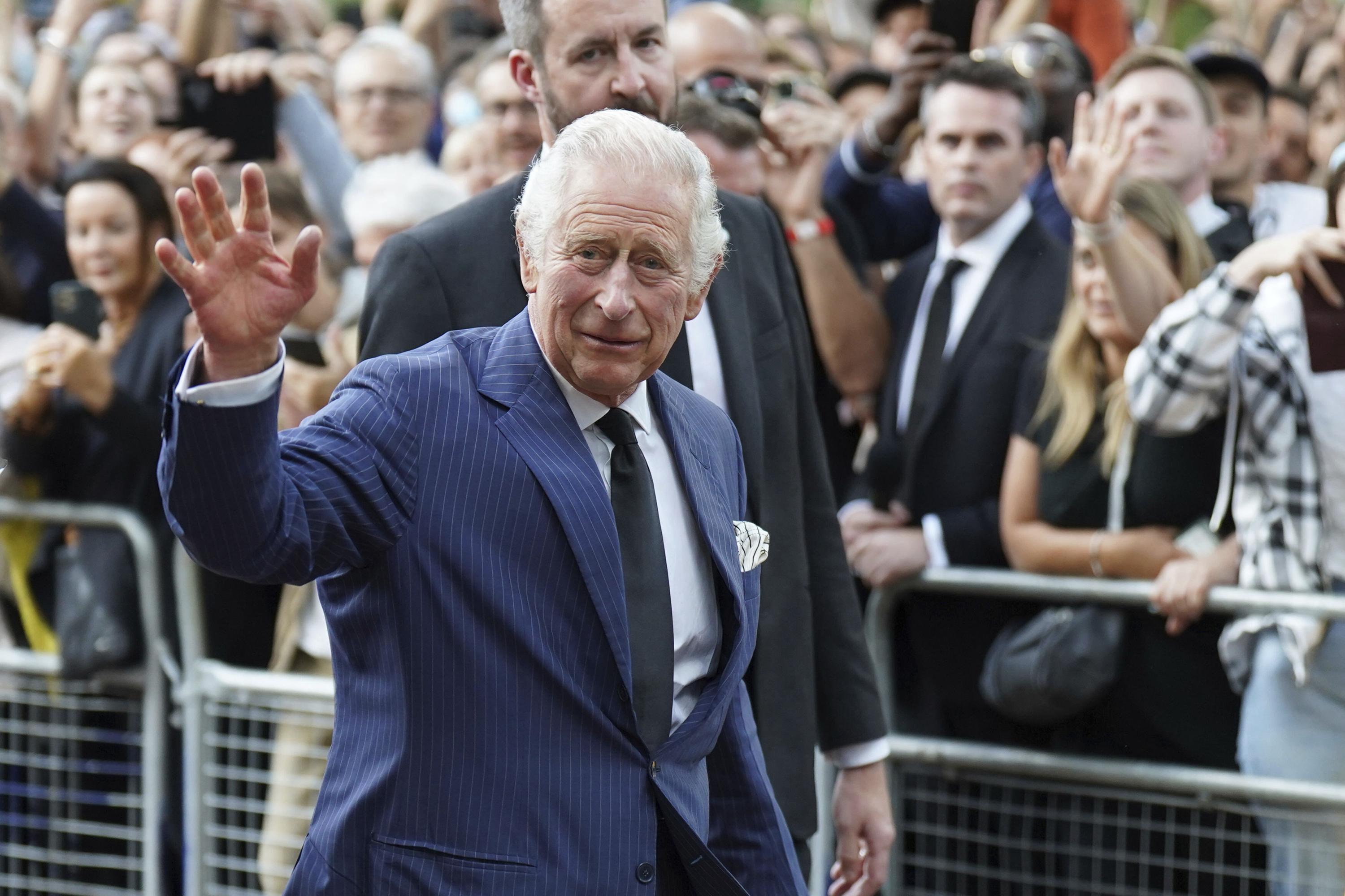 King Charles III greets members of the public outside Clarence House in London after he was formally proclaimed monarch by the Privy Council, Saturday Sept. 10, 2022. ( James Manning/PA via AP)