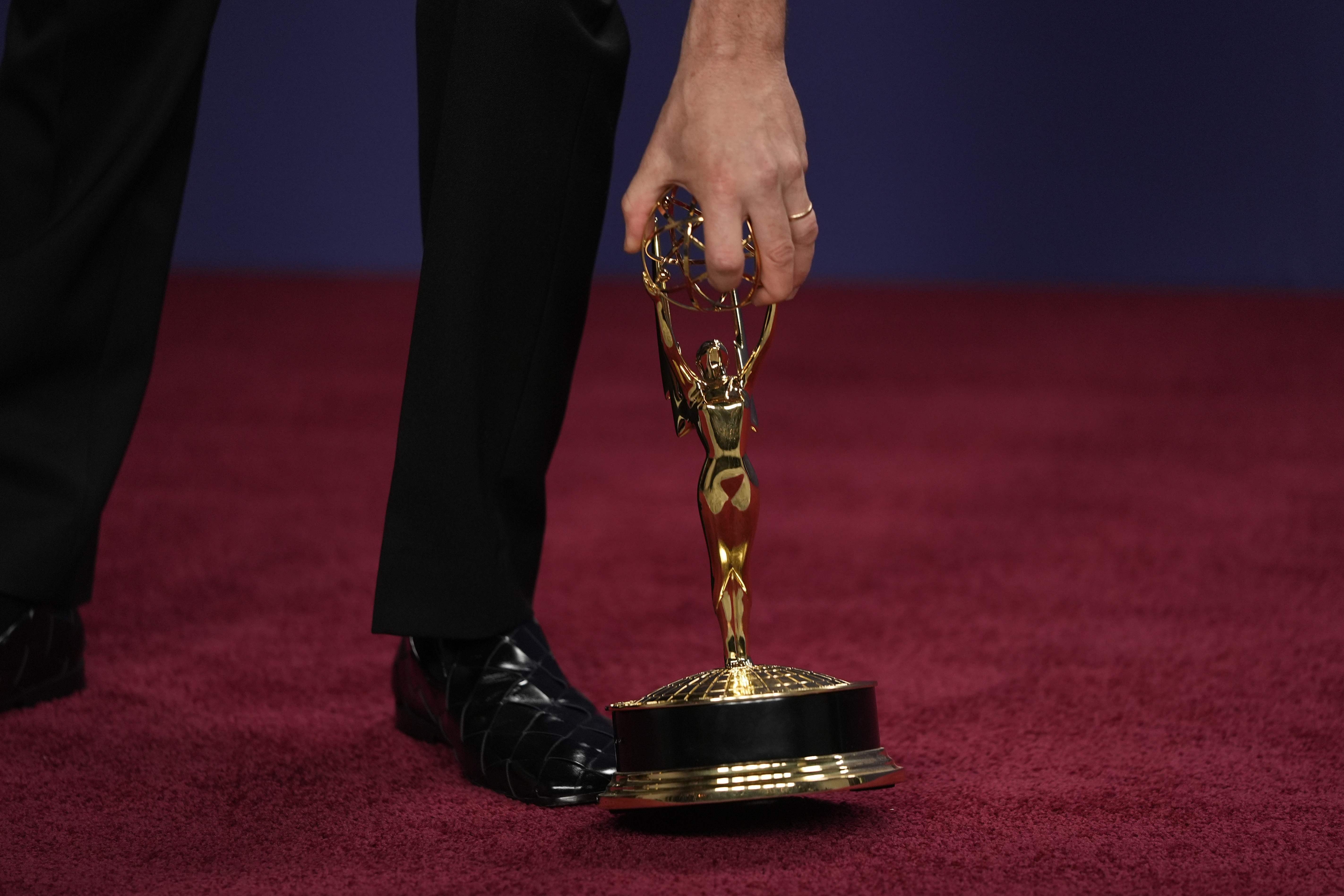 Ebon Moss-Bachrach poses in the press room with the award for outstanding supporting actor in a comedy series for "The Bear" during the 76th Primetime Emmy Awards on Sunday, Sept. 15, 2024, at the Peacock Theater in Los Angeles. (AP Photo/Jae C. Hong)