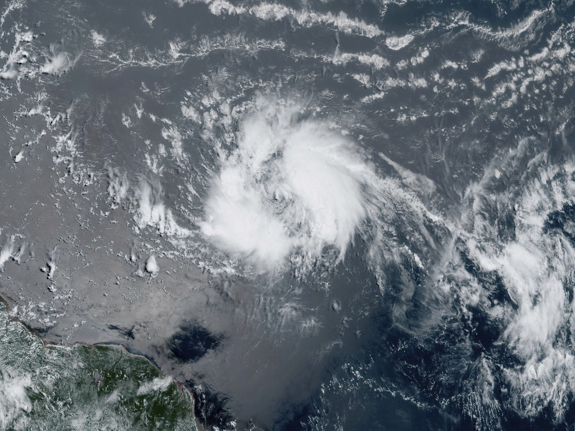 This GeoColor satellite image taken Tuesday, June 20, 2023 and provided by NOAA, shows Tropical Storm Bret as it chugged toward the eastern Caribbean. (NOAA via AP)