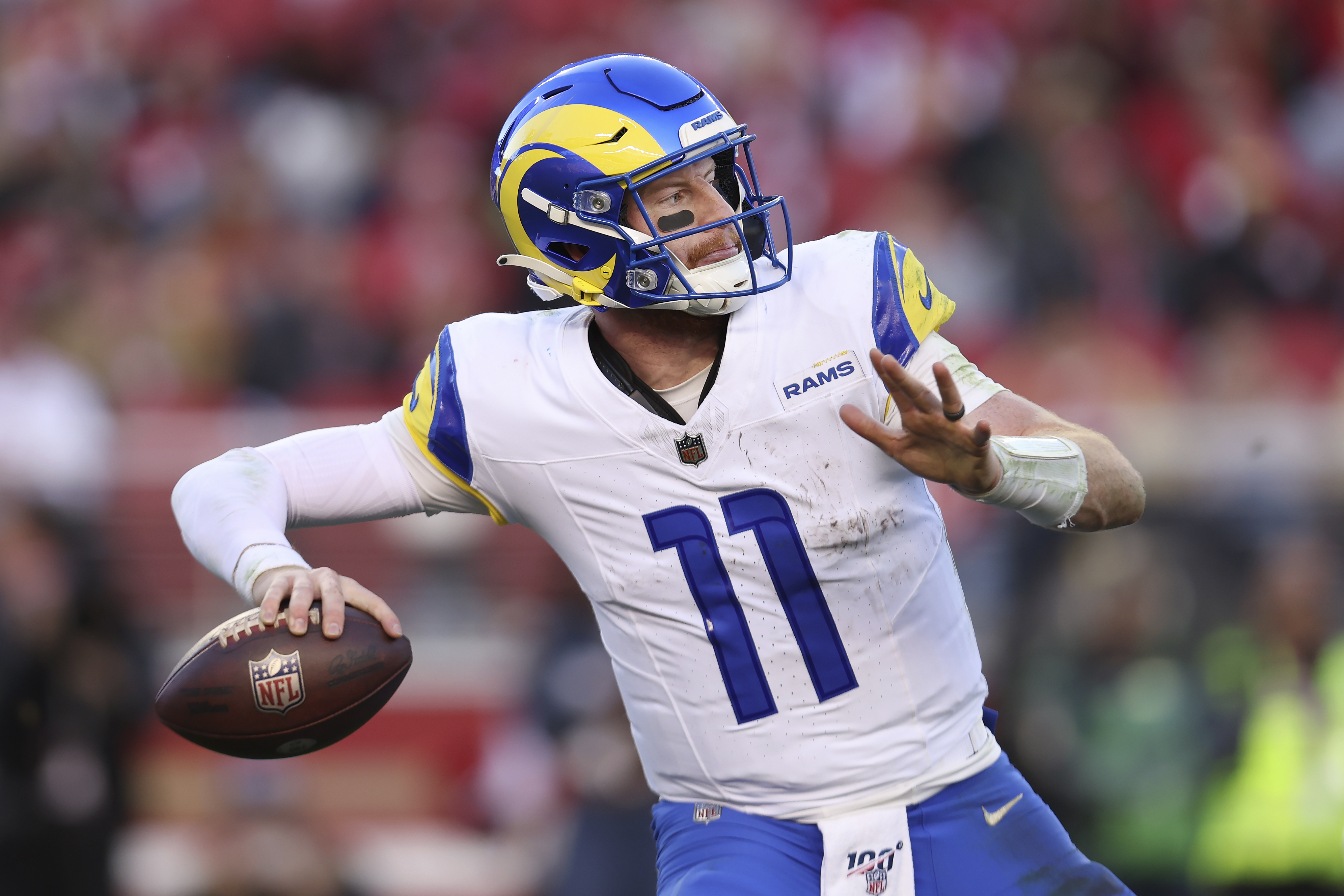 FILE - Los Angeles Rams quarterback Carson Wentz (11) passes against the San Francisco 49ers during the second half of an NFL football game in Santa Clara, Calif., Sunday, Jan. 7, 2024. Carson Wentz has agreed to a one-year contract with the Kansas City Chiefs, a person familiar with the deal told The Associated Press on Tuesday, April 2, 2024. (AP Photo/Jed Jacobsohn, File)