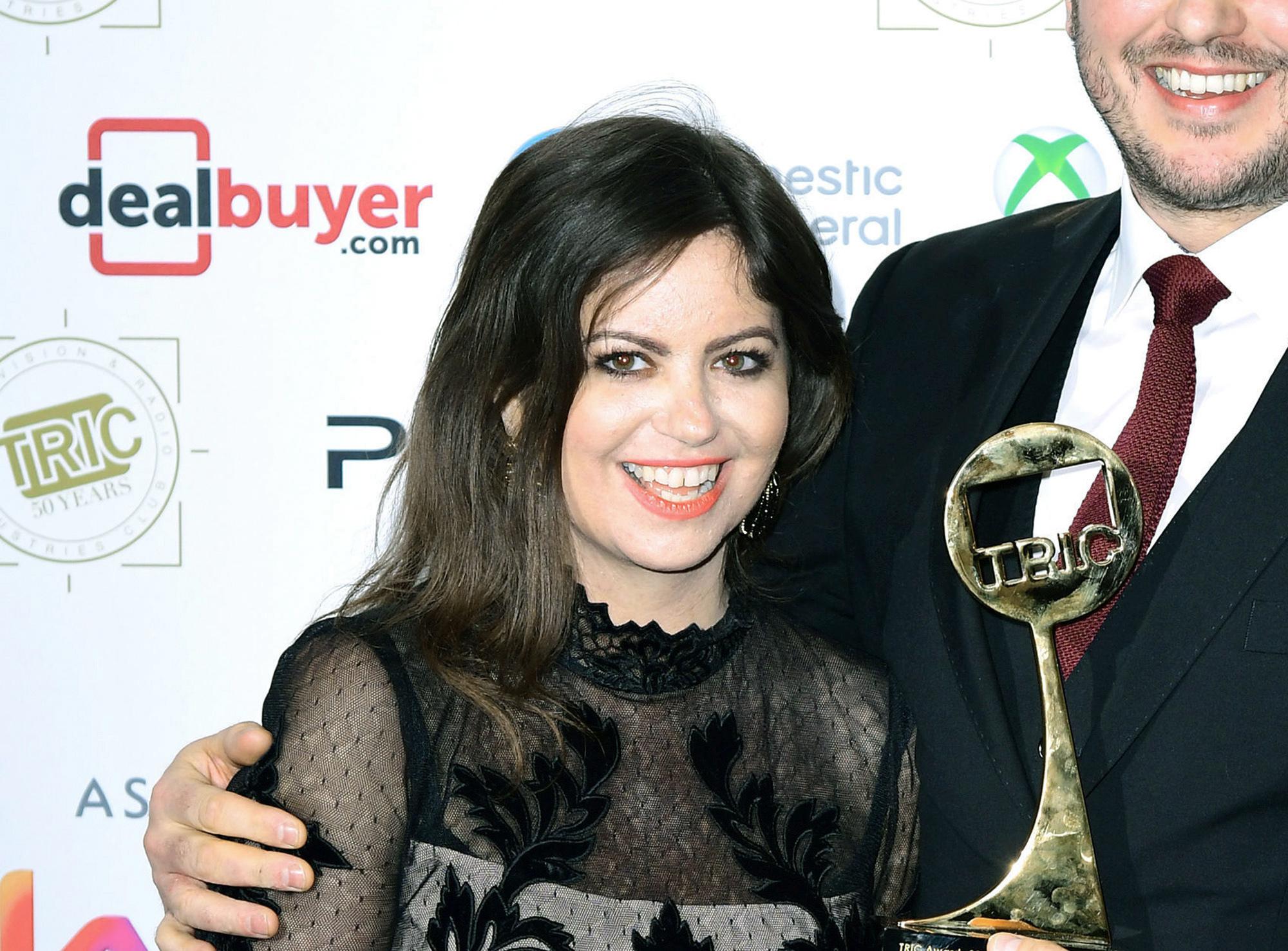 FILE Cancer Campaigner Deborah James, left and Steve Bland pose for a photo with the award for Best Podcast for the show You, Me and the Big C at the TRIC Awards 2019 50th Birthday Celebration, at the Grosvenor House Hotel, London, March 12, 2019. James, a B ritish broadcaster who raised millions for cancer research and was recognized by Prince William for her work, has died. She was 40. James hosted a BBC podcast called “You, Me and The Big C"  in which she spoke in a no-nonsense approach about living with bowel cancer. (Ian West/PA via AP, File)