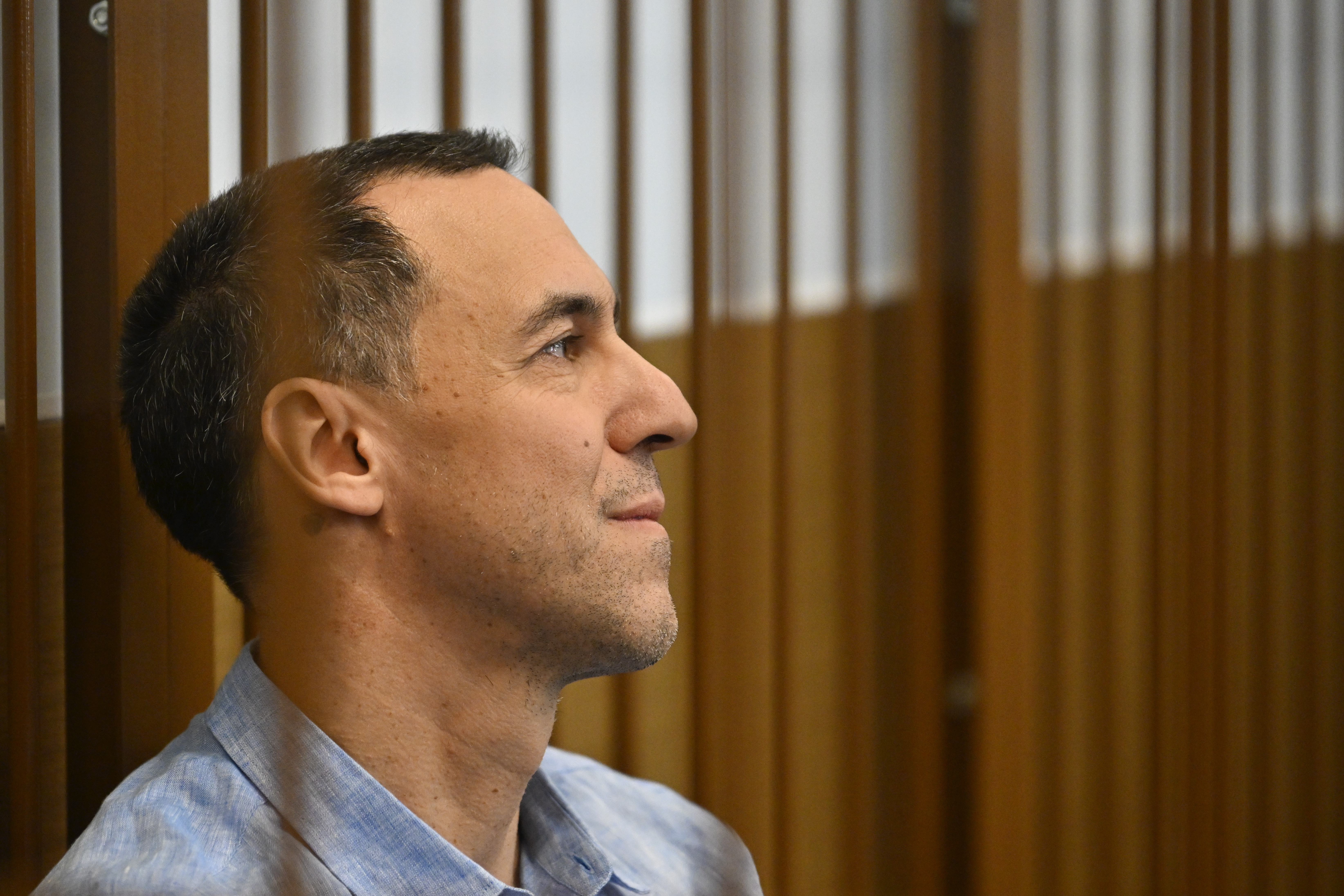 French citizen Laurent Vinatier sits in a cage in a courtroom in the Zamoskvoretsky District Court in Moscow, Russia, Monday, Sept. 16, 2024. (AP Photo/Dmitry Serebryakov)