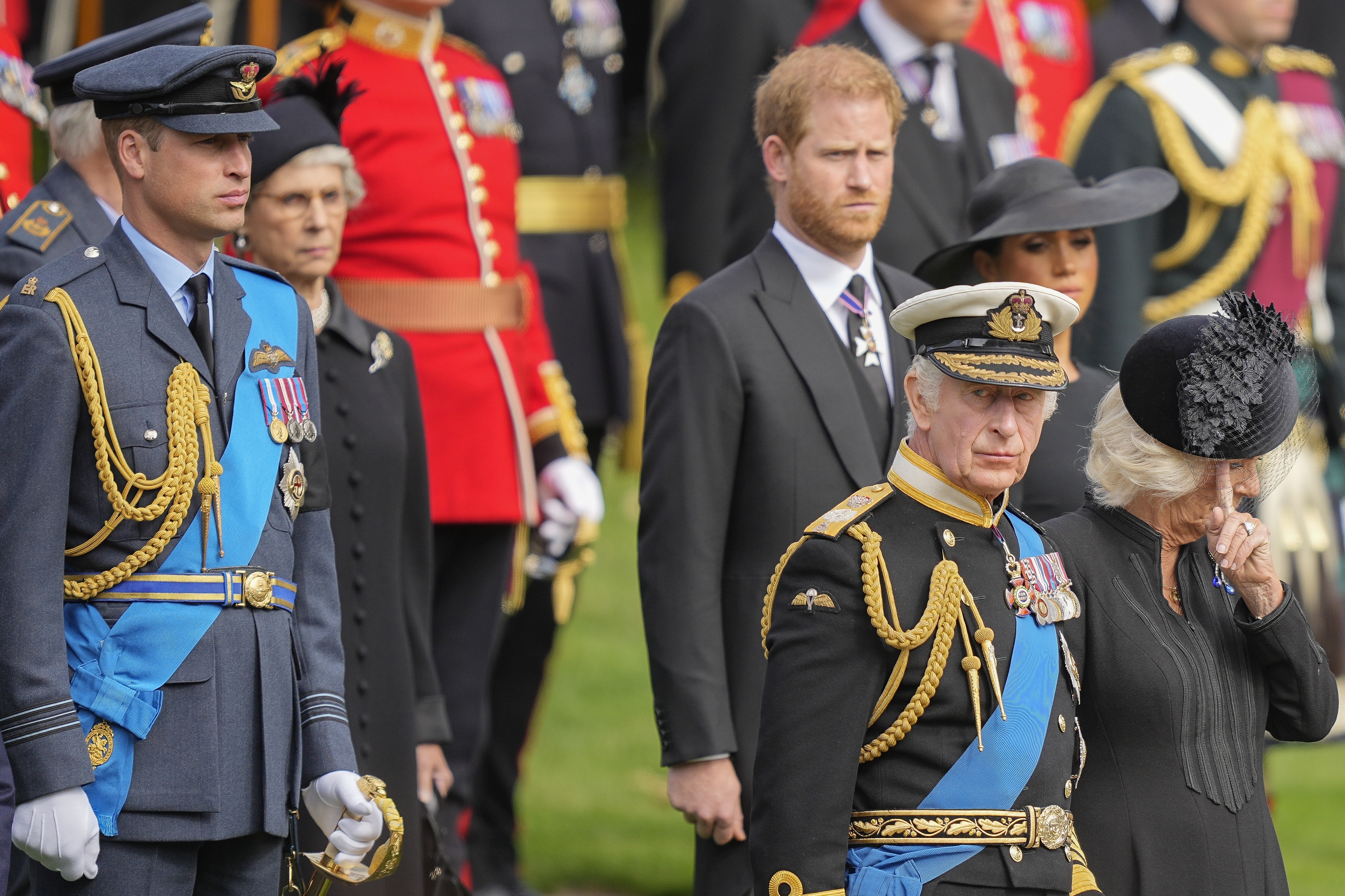 FILE - King Charles III, front right, Camilla, the Queen Consort, Prince Harry and Prince William watch as the coffin of Queen Elizabeth II is placed into the hearse following the state funeral service in Westminster Abbey in central London Monday Sept. 19, 2022. King Charles III has been diagnosed with a form of cancer and has begun treatment, Buckingham Palace says on Monday, Feb. 5, 2024. (AP Photo/Martin Meissner, Pool, File)