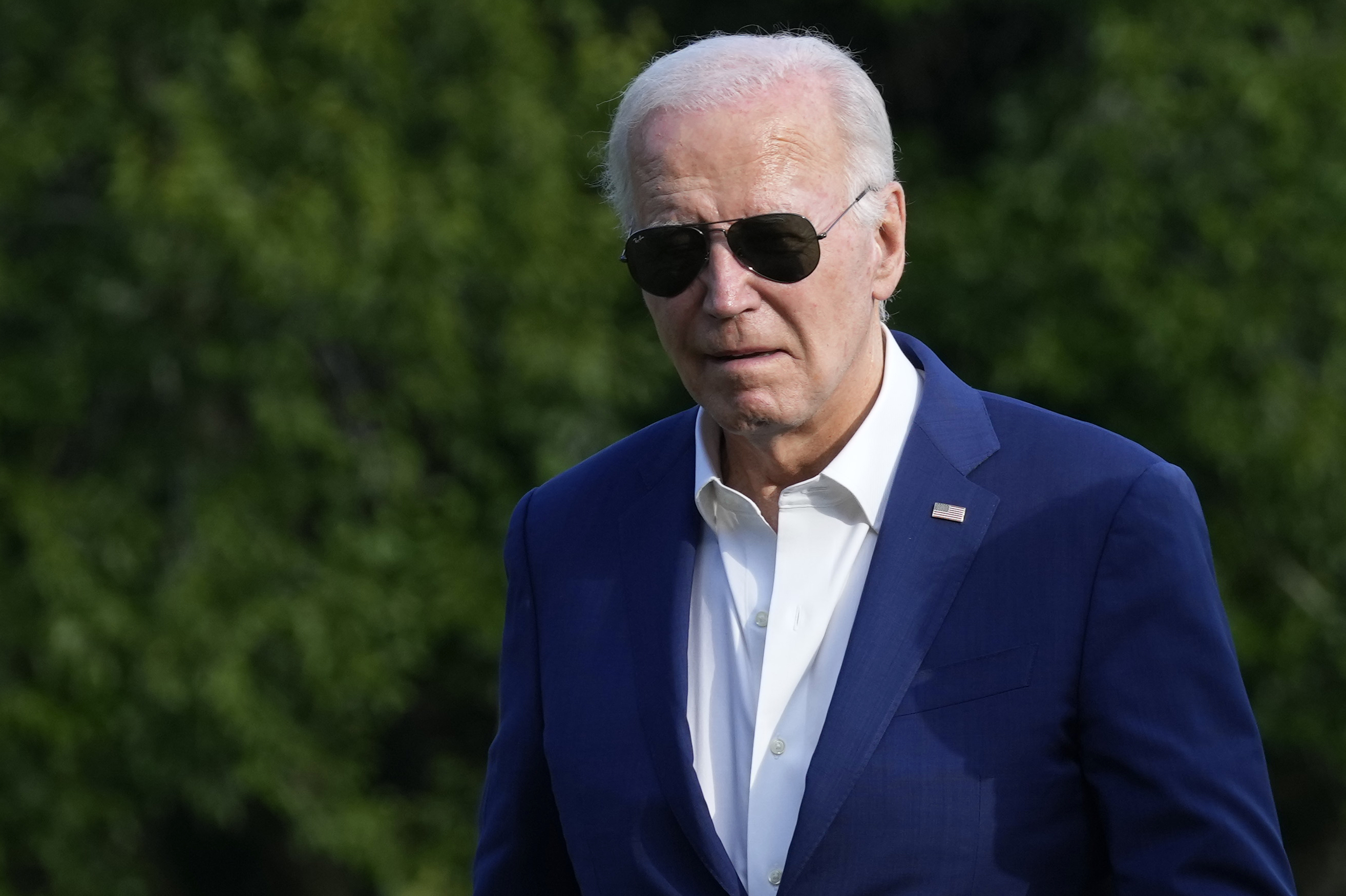 President Joe Biden walks across the South Lawn of the White House in Washington, Sunday, July 7, 2024, after returning from a trip to Pennsylvania. (AP Photo/Susan Walsh)