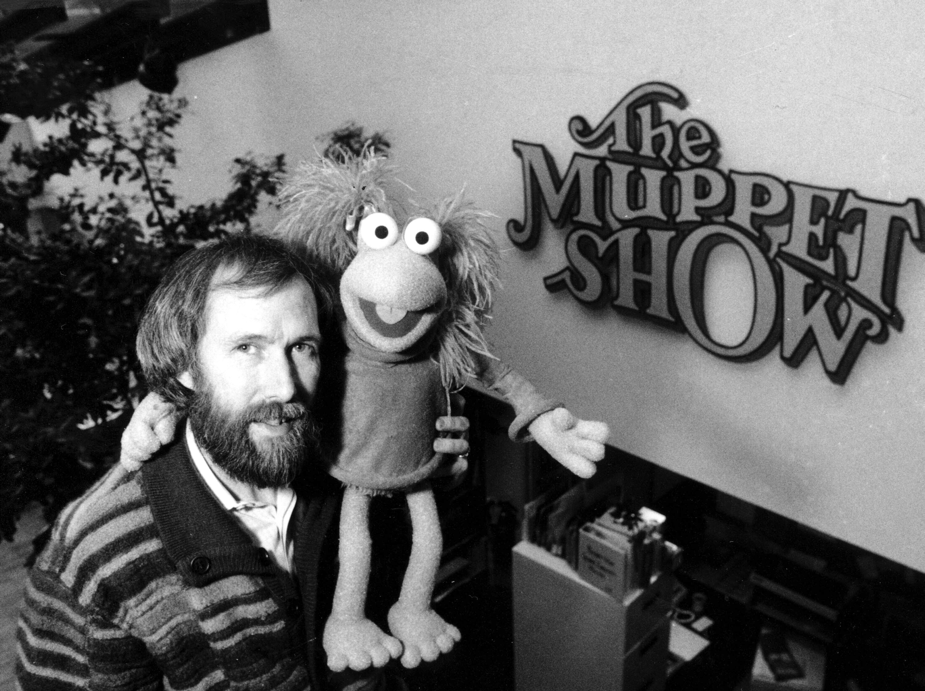 FILE - Muppet creator Jim Henson poses with one of his creations at Henson's 69th Street office in New York City on Feb. 6, 1984. Henson is the subject of the documentary "Jim Henson: Idea Man." (AP Photo/G. Paul Burnett, File)