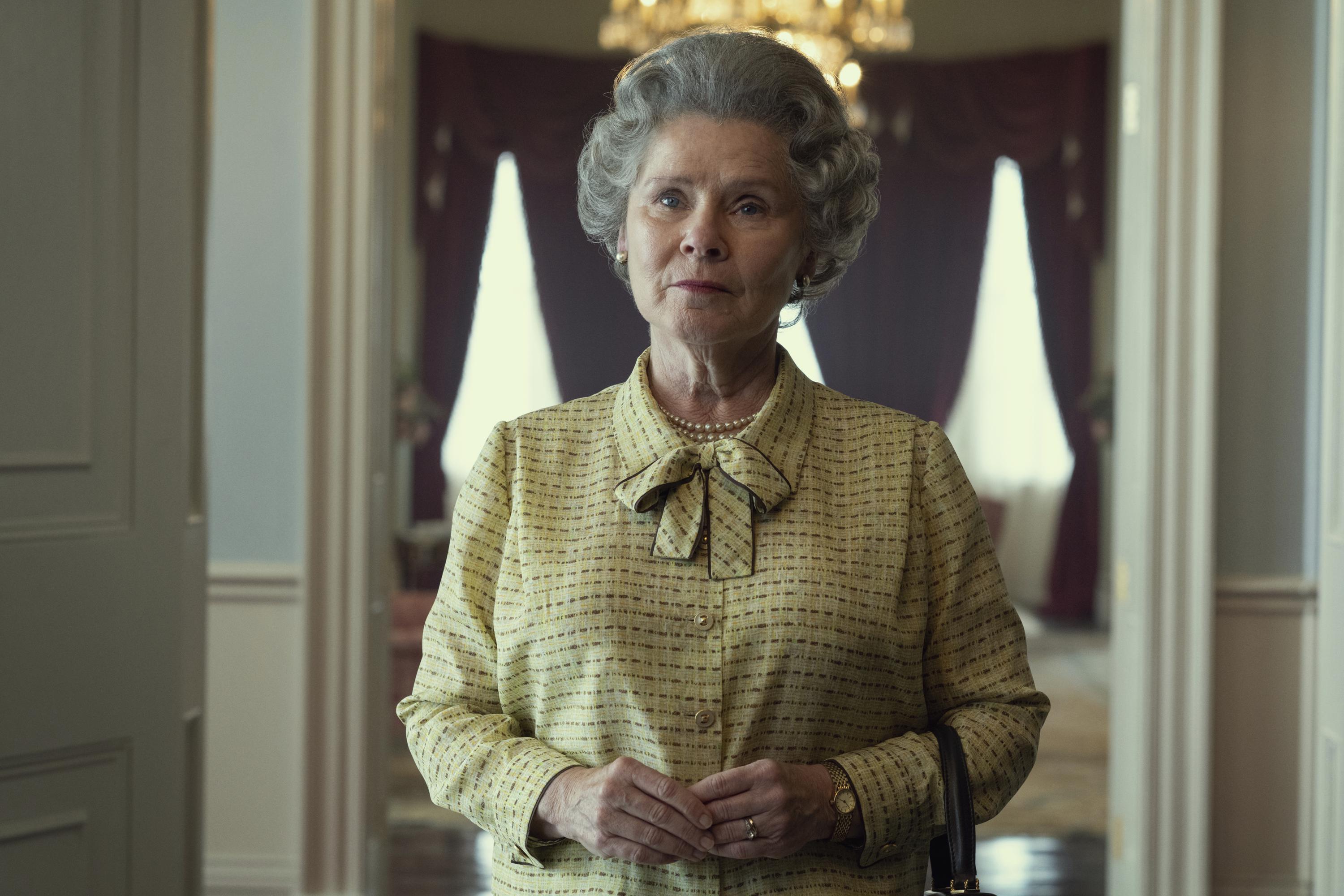 This image released by Netflix shows Imelda Staunton as Queen Elizabeth in "The Crown." Netflix’s acclaimed series about Queen Elizabeth II and her family, has paused production due to the monarch’s death.  (Alex Bailey/Netflix via AP)