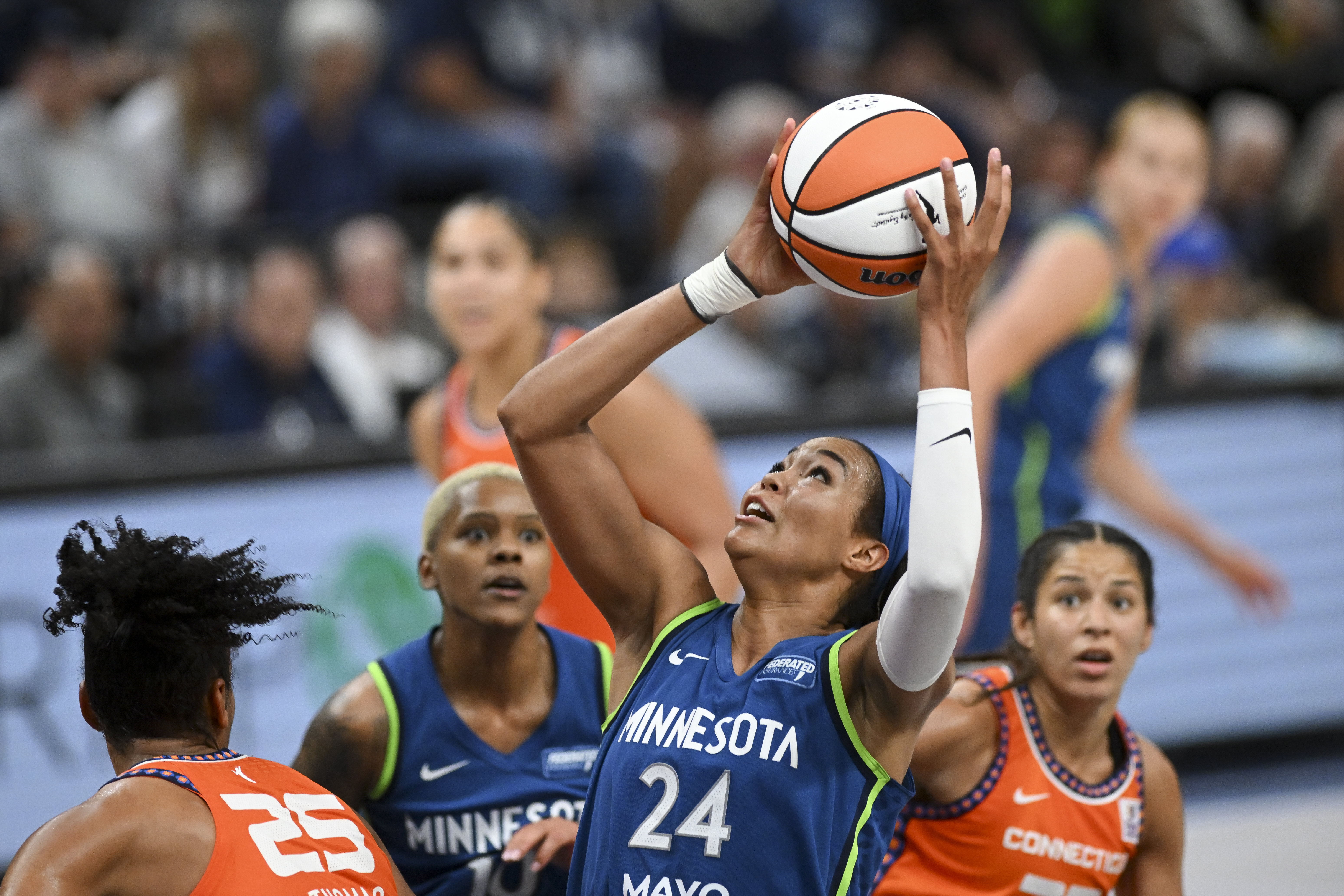 Minnesota Lynx forward Napheesa Collier (24) pulls down a rebound against the Connecticut Sun during the second half of a WNBA basketball game, Thursday, July 4, 2024 in Minneapolis. (Aaron Lavinsky/Star Tribune via AP)