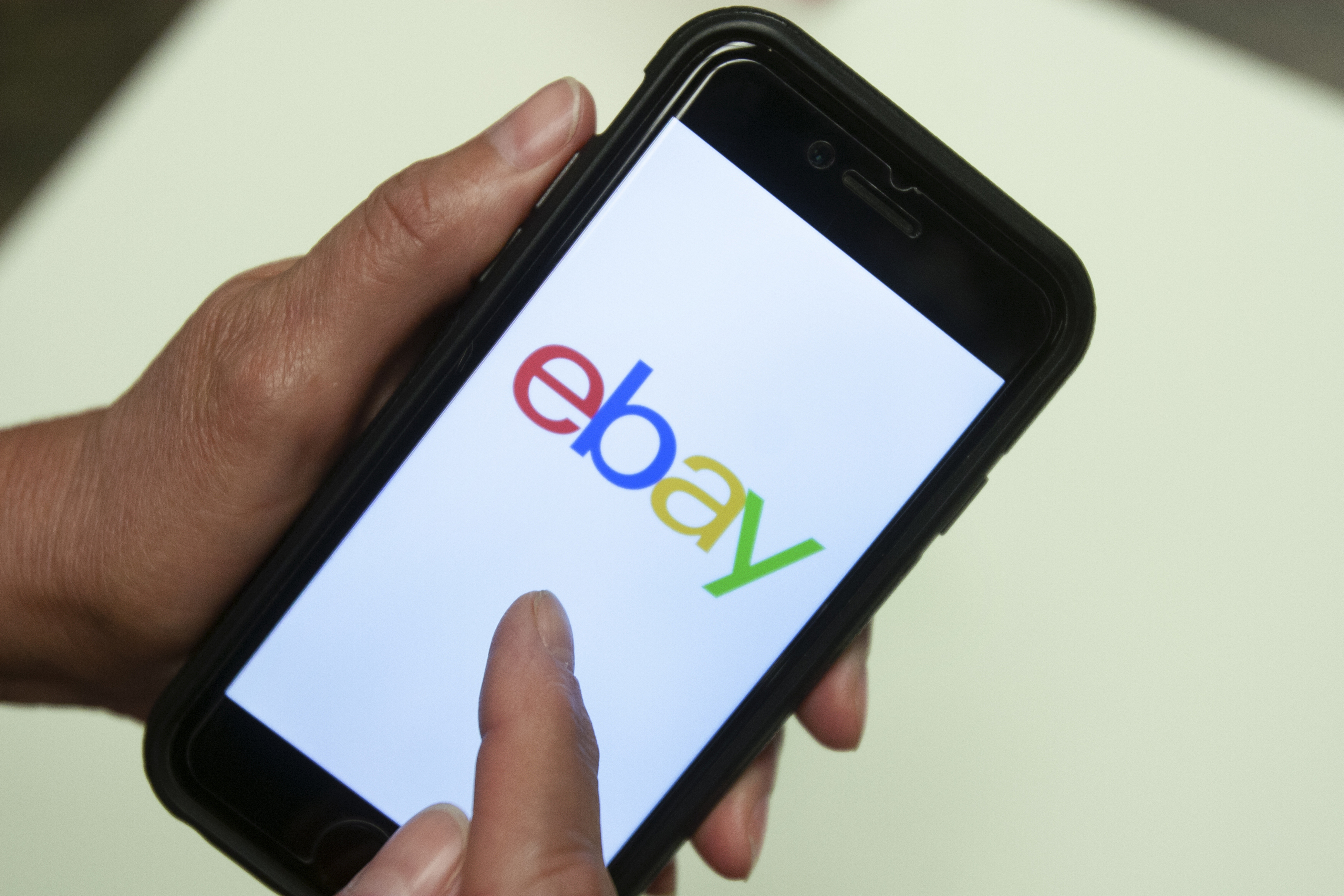 FILE - An eBay app is shown on a mobile phone, July 11, 2019, in Miami. (AP Photo/Wilfredo Lee, File)