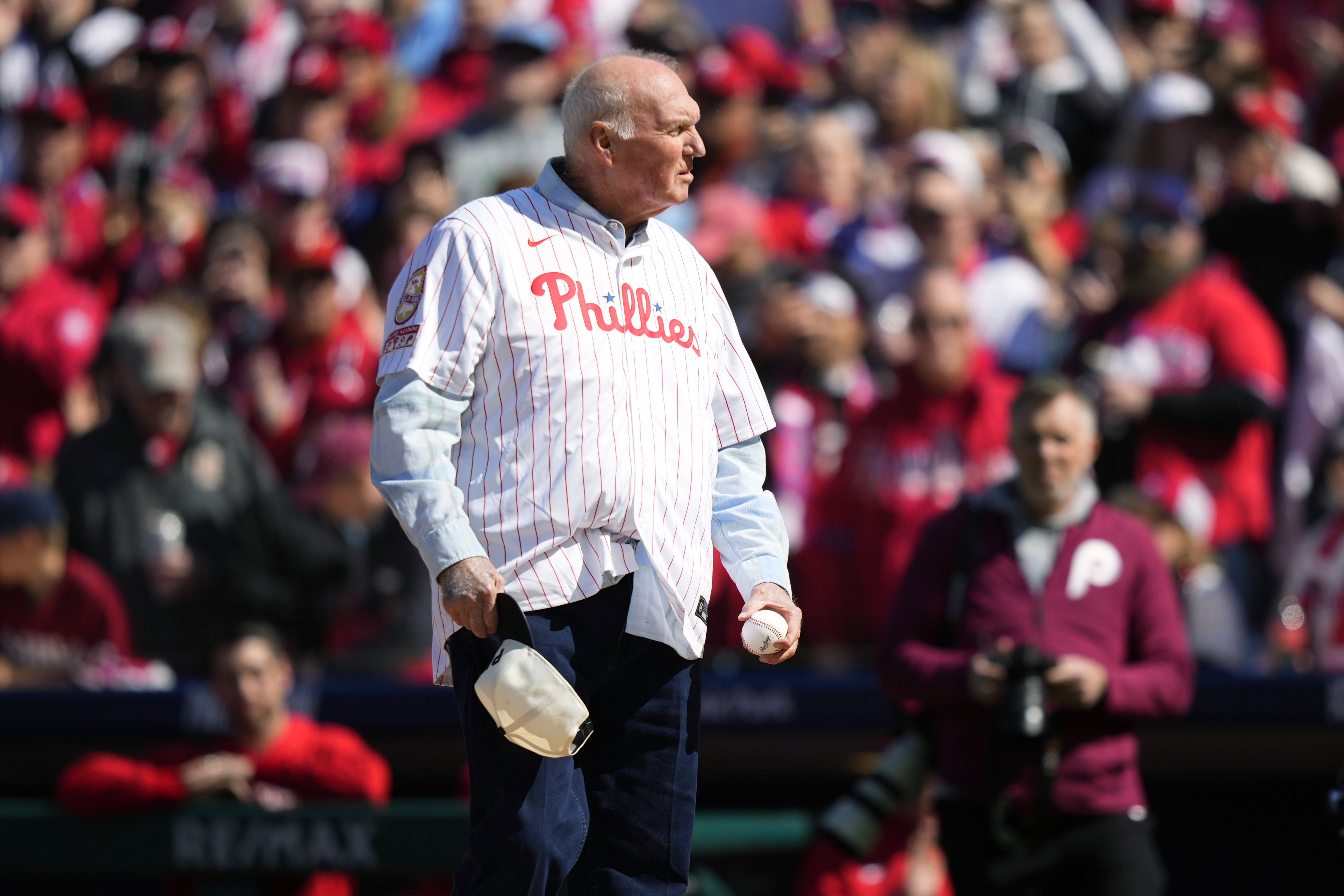 FILE - Former Philadelphia Phillies manager Charlie Manuel stands on the field before the Phillies' baseball game against the Atlanta Braves on March 29, 2024, in Philadelphia. Nine months after suffering a stroke, the 80-year-old hitting guru is back to sharing his knowledge of the game with anyone who wants to learn from a World Series champion. Manuel still works as a senior adviser for the Phillies and he’s already scouted the team’s Single-A affiliate in Clearwater. He’s heading to Double-A Reading next week and plans to visit the MLB-leading Phillies at Citizens Bank Park. (AP Photo/Matt Slocum, File)