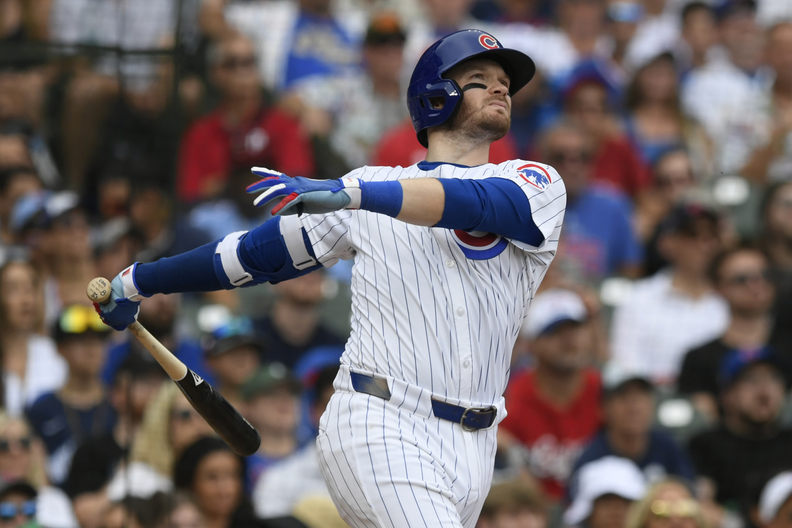 Chicago Cubs' Ian Happ watches his three-run home run during the fifth inning of a baseball game against the Philadelphia Phillies, Thursday, July 4, 2024, in Chicago. (AP Photo/Paul Beaty)