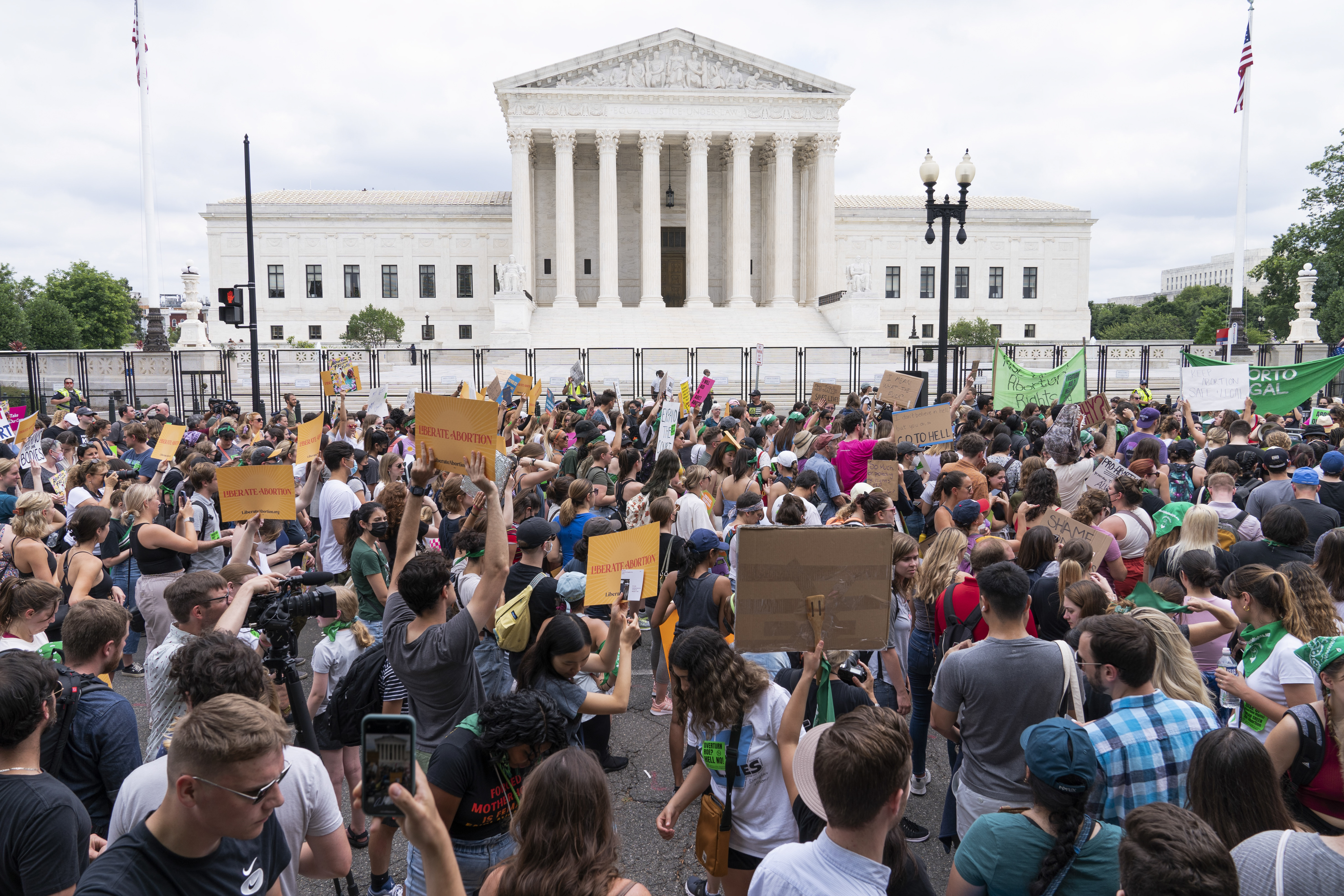 FILE - Protesters gather outside the Supreme Court in Washington, Friday, June 24, 2022, after the Supreme Court ended constitutional protections for abortion that had been in place nearly 50 years. More than a quarter of female Black voters describe abortion as their top issue in this year's presidential election, a new survey out Thursday from health policy research firm KFF finds. (AP Photo/Jacquelyn Martin, File)