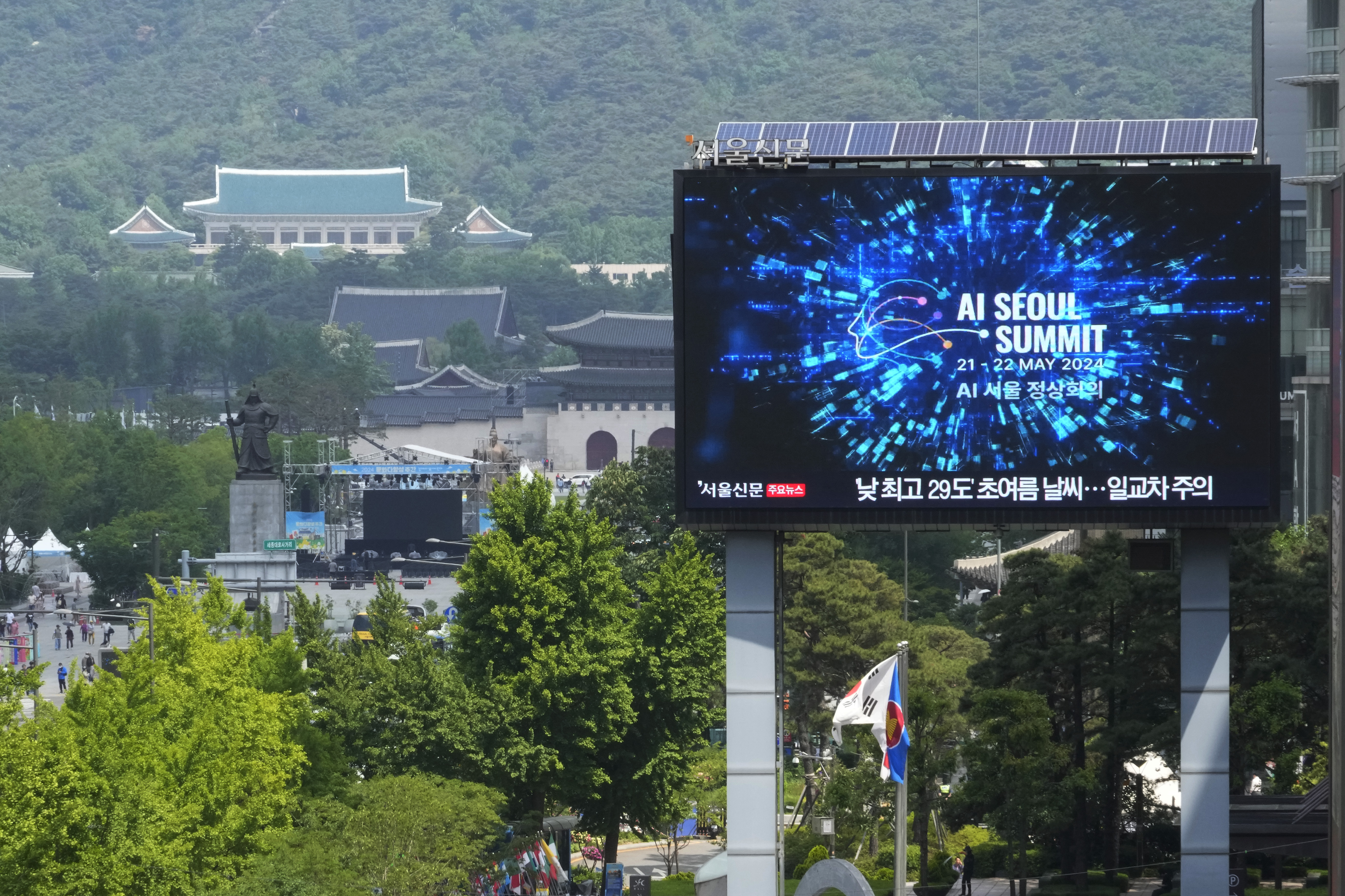 A screen shows an announcement of the AI Seoul Summit in Seoul, South Korea, Tuesday, May 21, 2024. World leaders are expected to adopt a new agreement on artificial intelligence when they gather virtually Tuesday to discuss AI’s potential risks but also ways to promote its benefits and innovation. (AP Photo/Ahn Young-joon)