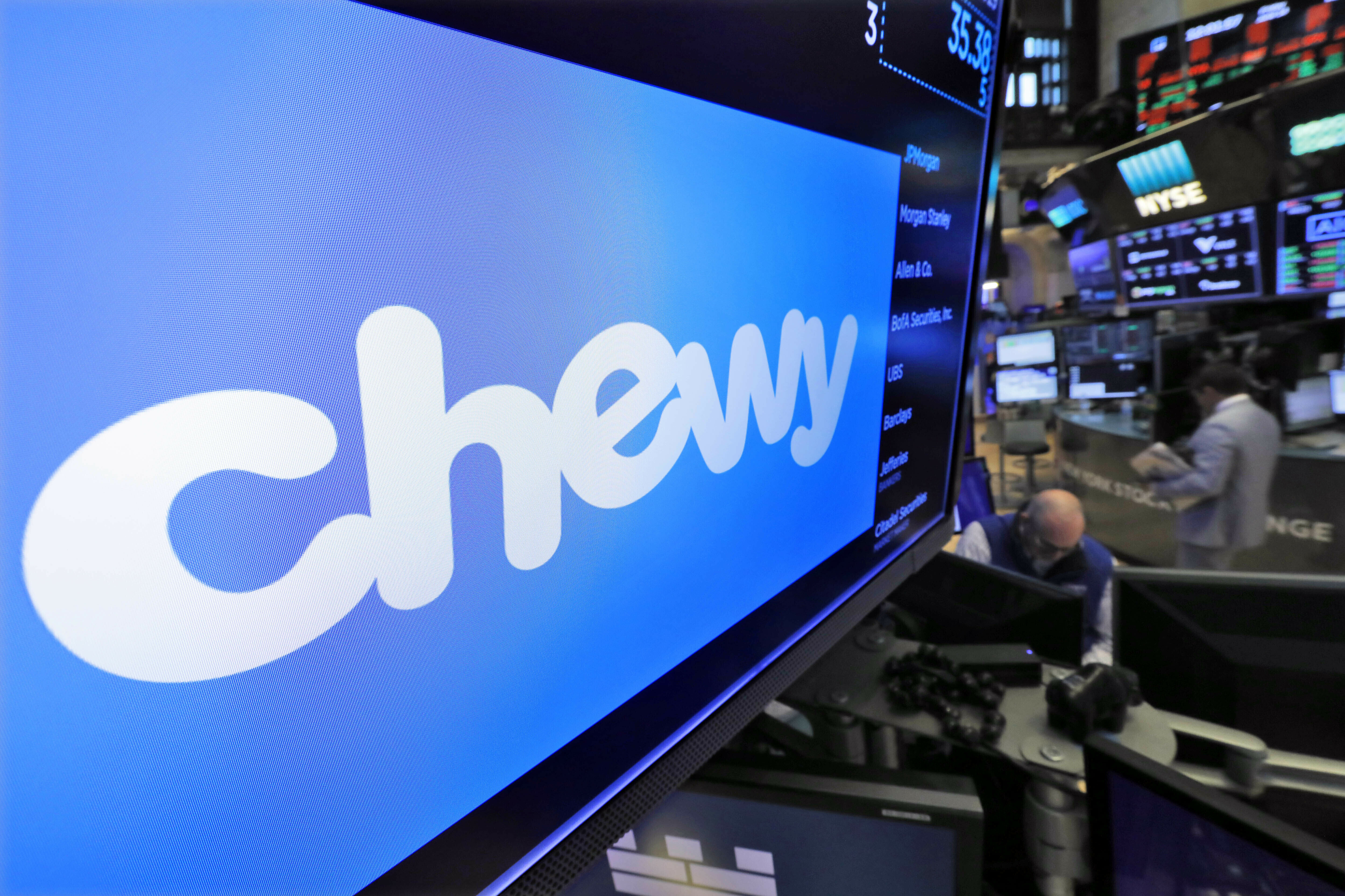 FILE - The logo for Chewy appears above trading posts on the floor of the New York Stock Exchange, June 14, 2019. Shares for Chewy jumped in premarket trading early Monday, July 1, 2024, after a regulatory filing disclosed that Roaring Kitty, an investor at the center of the meme stock craze, had taken a 6.6% stake in the online pet retailer. (AP Photo/Richard Drew, File)