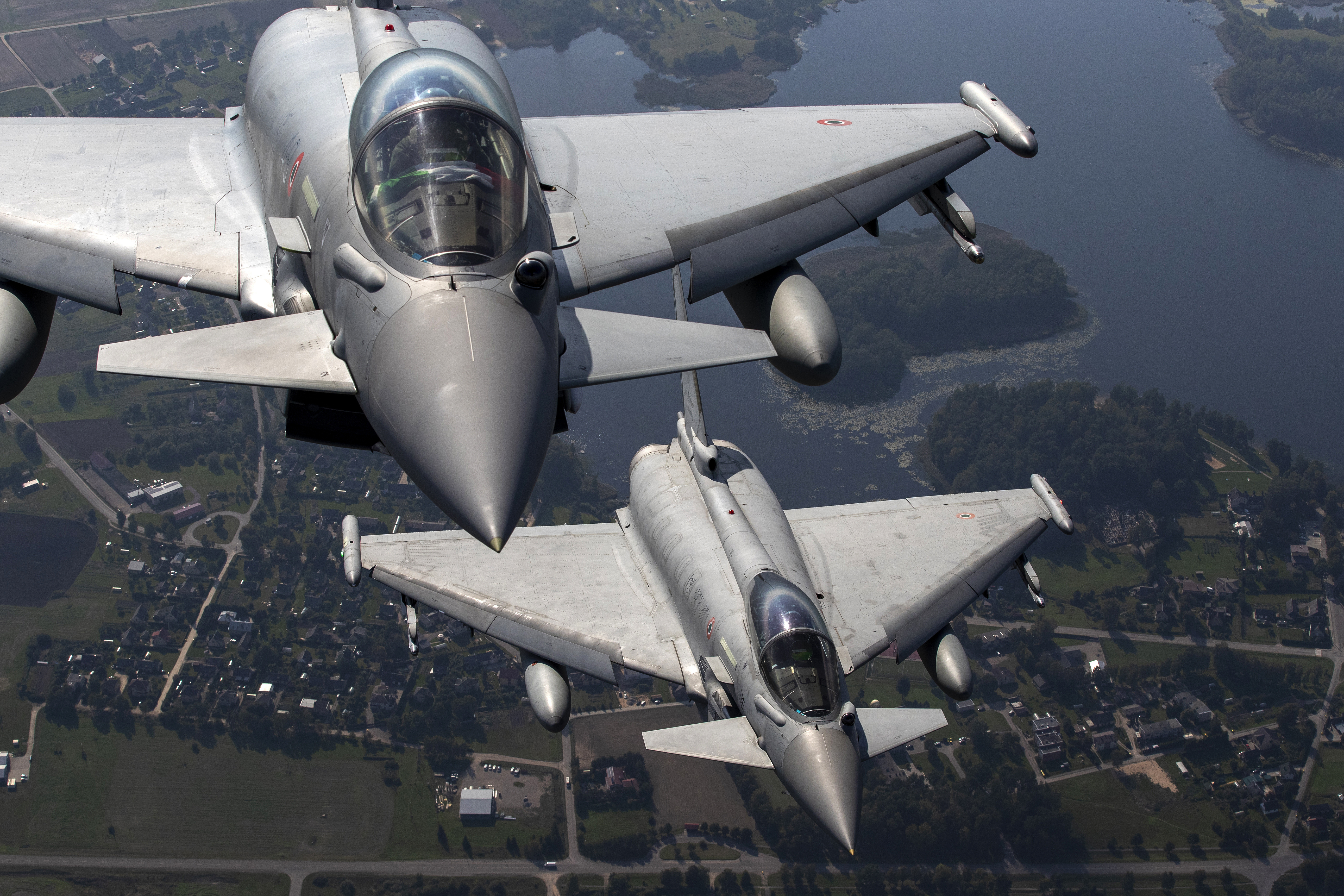 FILE - Italian Air Force Eurofighter Typhoon military fighter jets participate in NATO's Baltic Air Policing Mission operate in Lithuanian airspace, on Sept.12, 2023. NATO grew out of secret talks among U.S. officials after World War II about how to supply military equipment to Western Europe and ensure a coordinated response to any attack by the Soviet Union. (AP Photo/Mindaugas Kulbis, File)