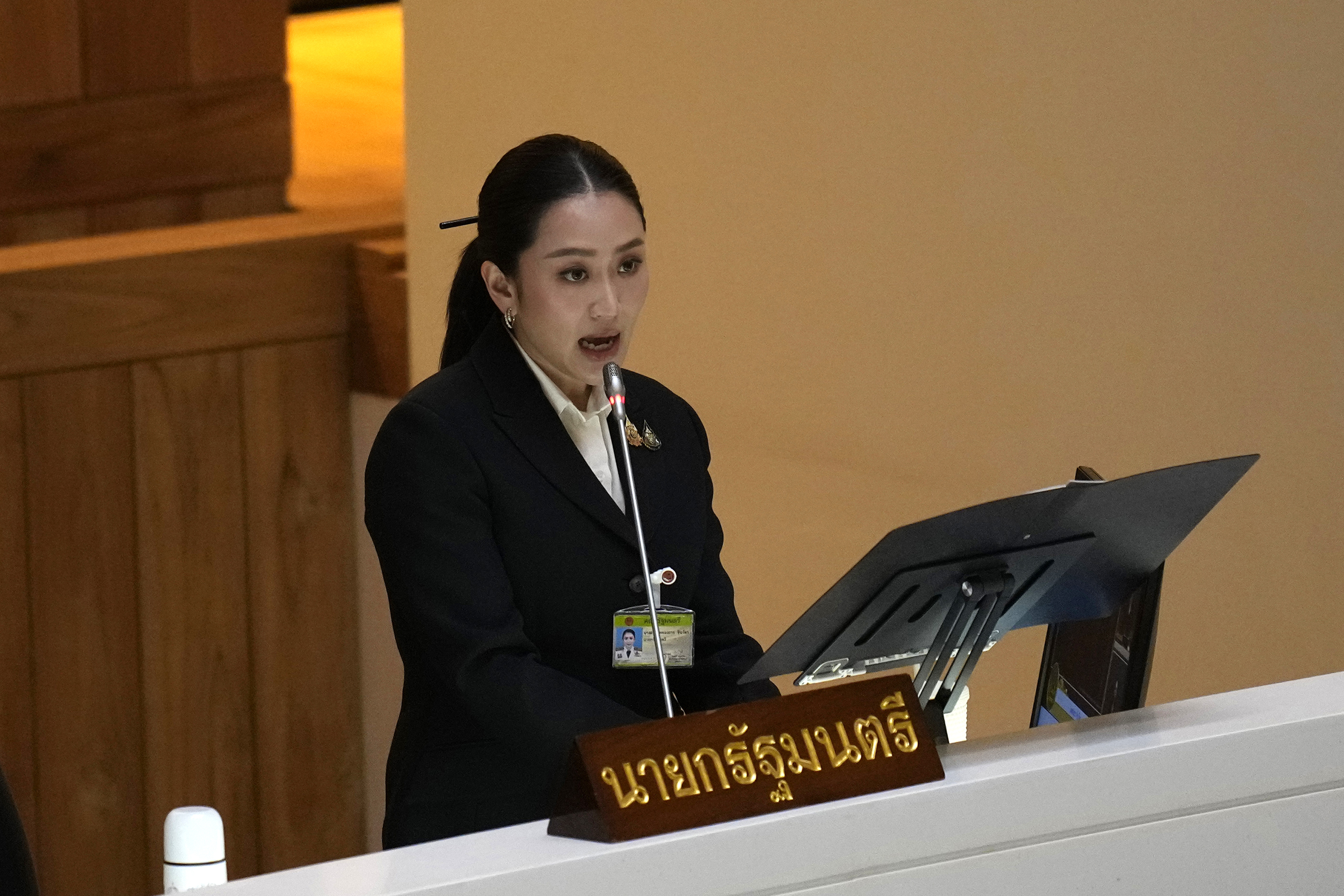 Thailand's Prime Minister Paetongtarn Shinawatra reads the policy statement at parliament in Bangkok, Thailand, Thursday, Sept. 12, 2024. Paetongtarn appeared Parliament for the first time to lay out how her government envisions to improve the country. (AP Photo/Sakchai Lalit)