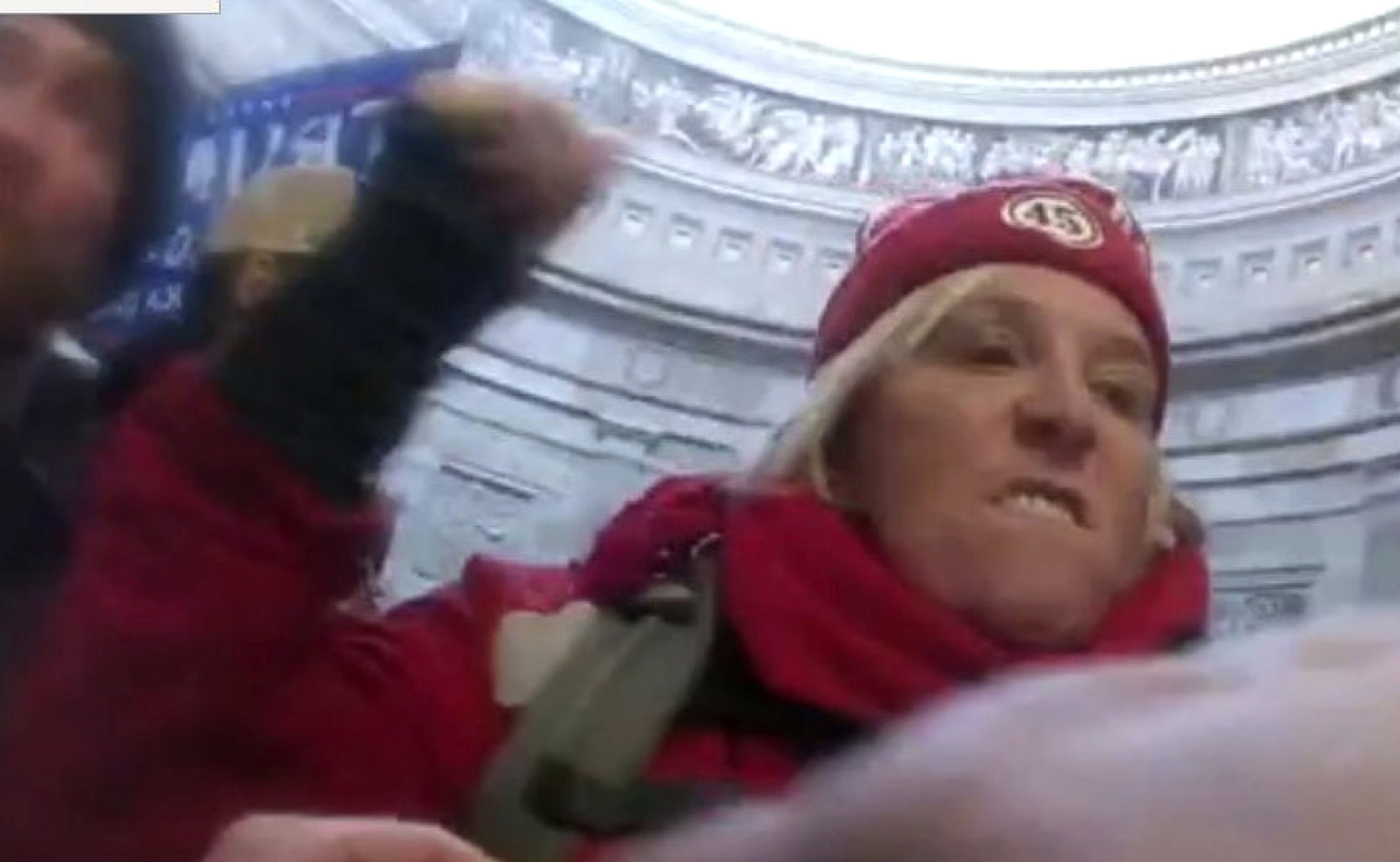 This image from U.S. Capitol Police body-worn video that was in the government sentencing memorandum in the case, shows Jacquelyn Starer, a physician from Massachusetts, striking a police officer in the Rotunda of the U.S. Capitol on Jan. 6, 2021, in Washington. (U.S. Capitol Police via AP)