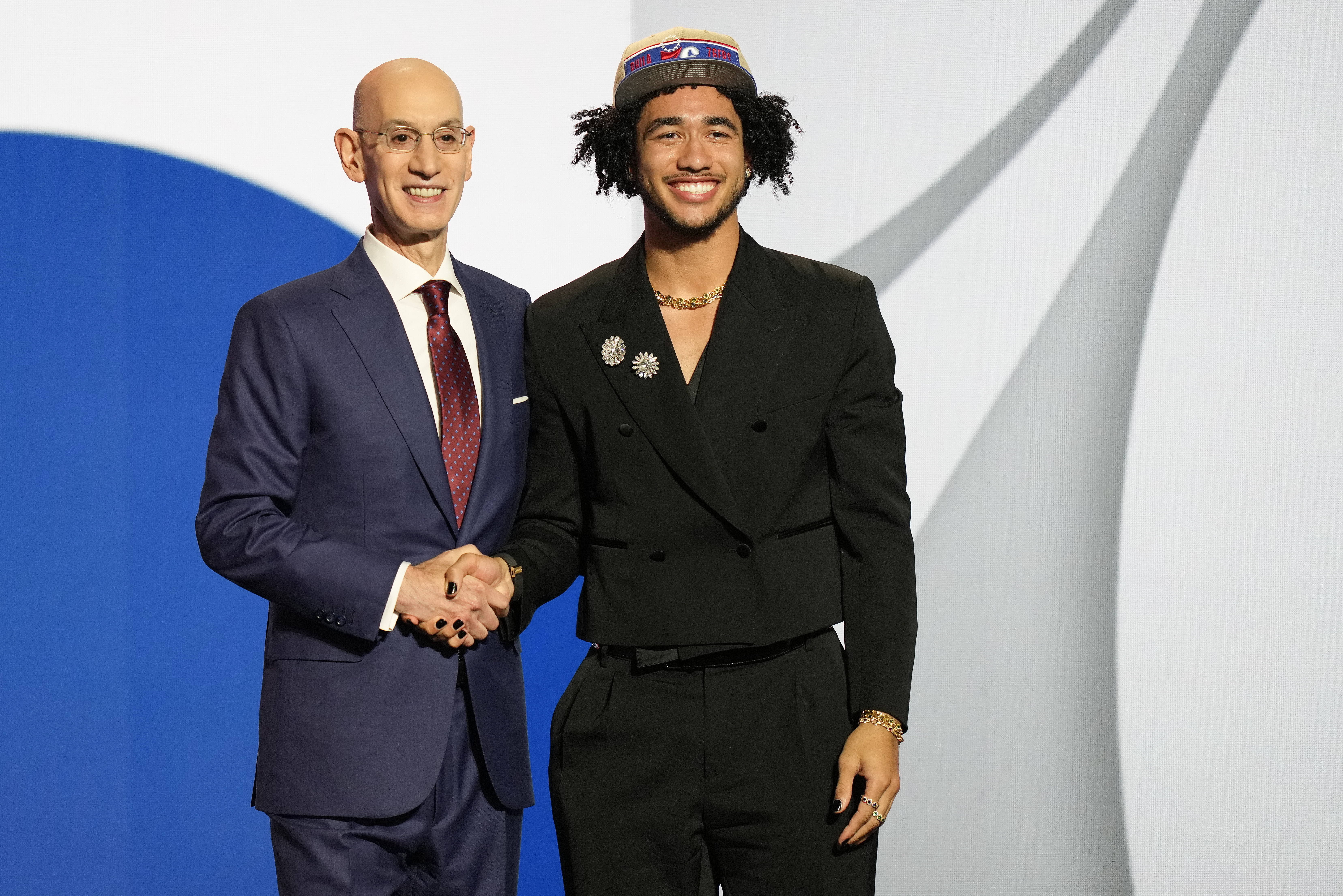 Jared McCain poses for a photo with NBA commissioner Adam Silver after being selected 16th by the Philadelphia 76ers during the first round of the NBA basketball draft, Wednesday, June 26, 2024, in New York. (AP Photo/Julia Nikhinson)