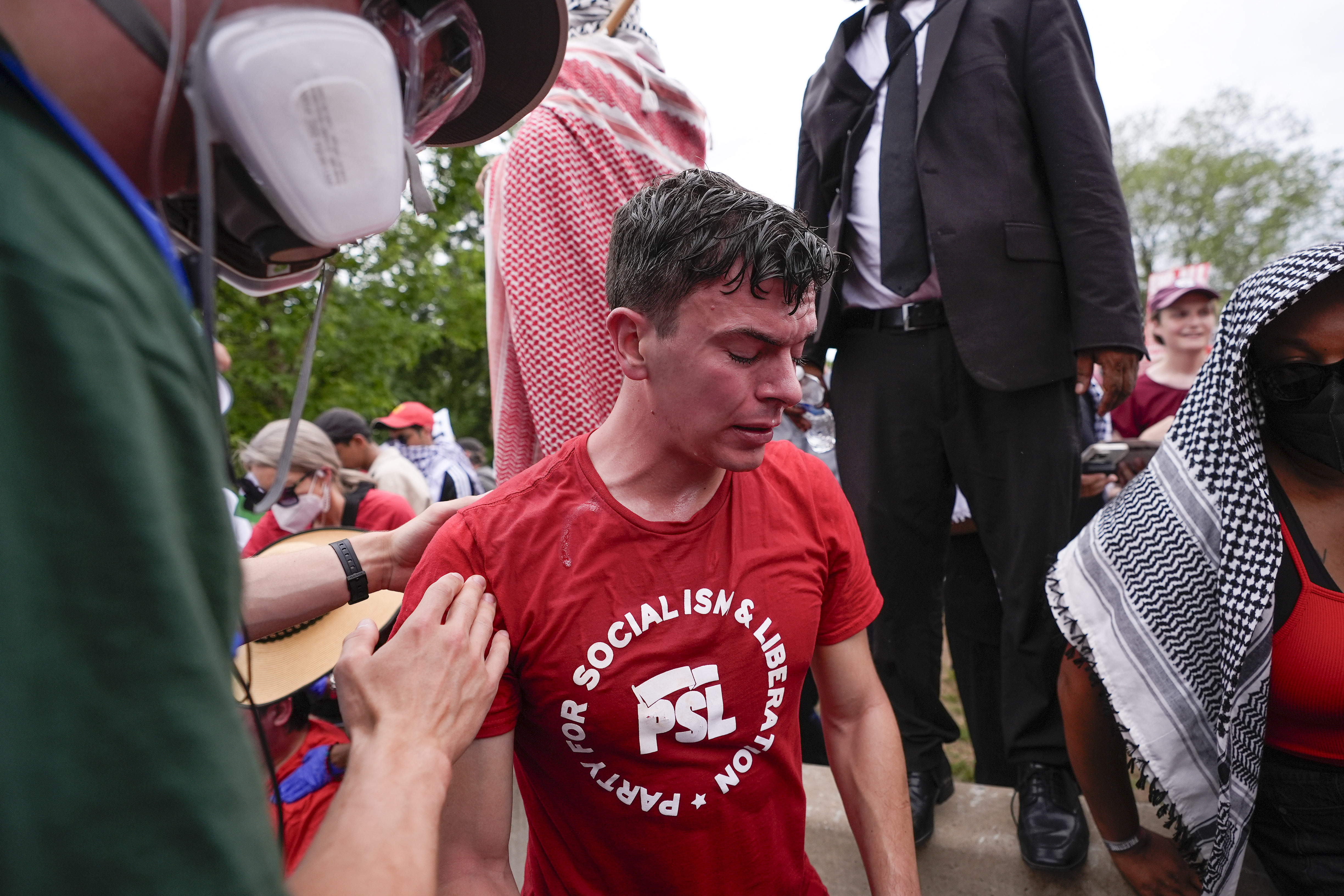 First aid is administered to a demonstrator at a protest near the Capitol during Israeli Prime Minister Benjamin Netanyahu's visit on Wednesday, July 24, 2024, in Washington. (AP Photo/Matt Slocum)