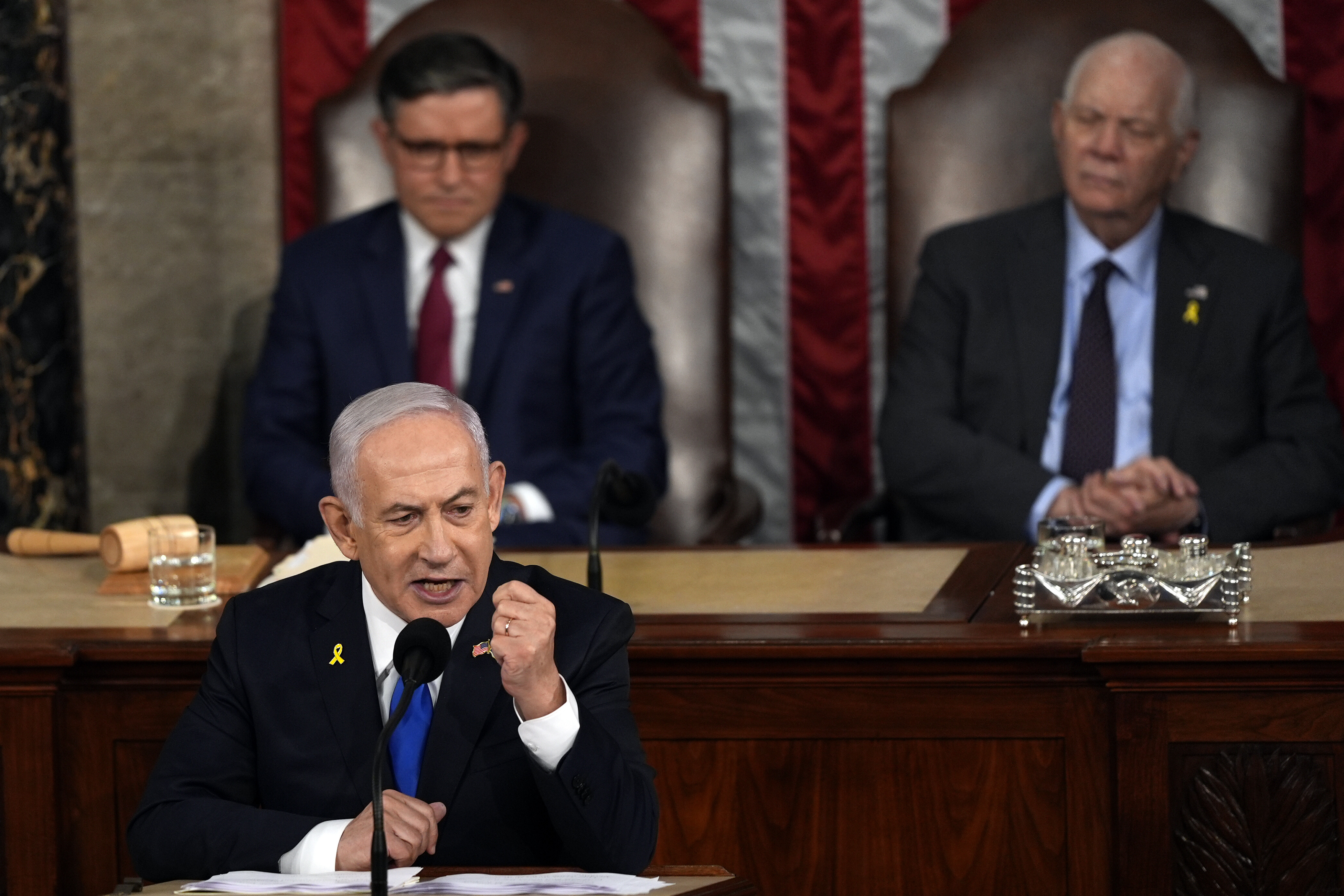 Israeli Prime Minister Benjamin Netanyahu speaks to a joint meeting of Congress, July 24, as House Speaker Mike Johnson and Senate Foreign Relations Chair Ben Cardin listen. (AP Photo/Julia Nikhinson)