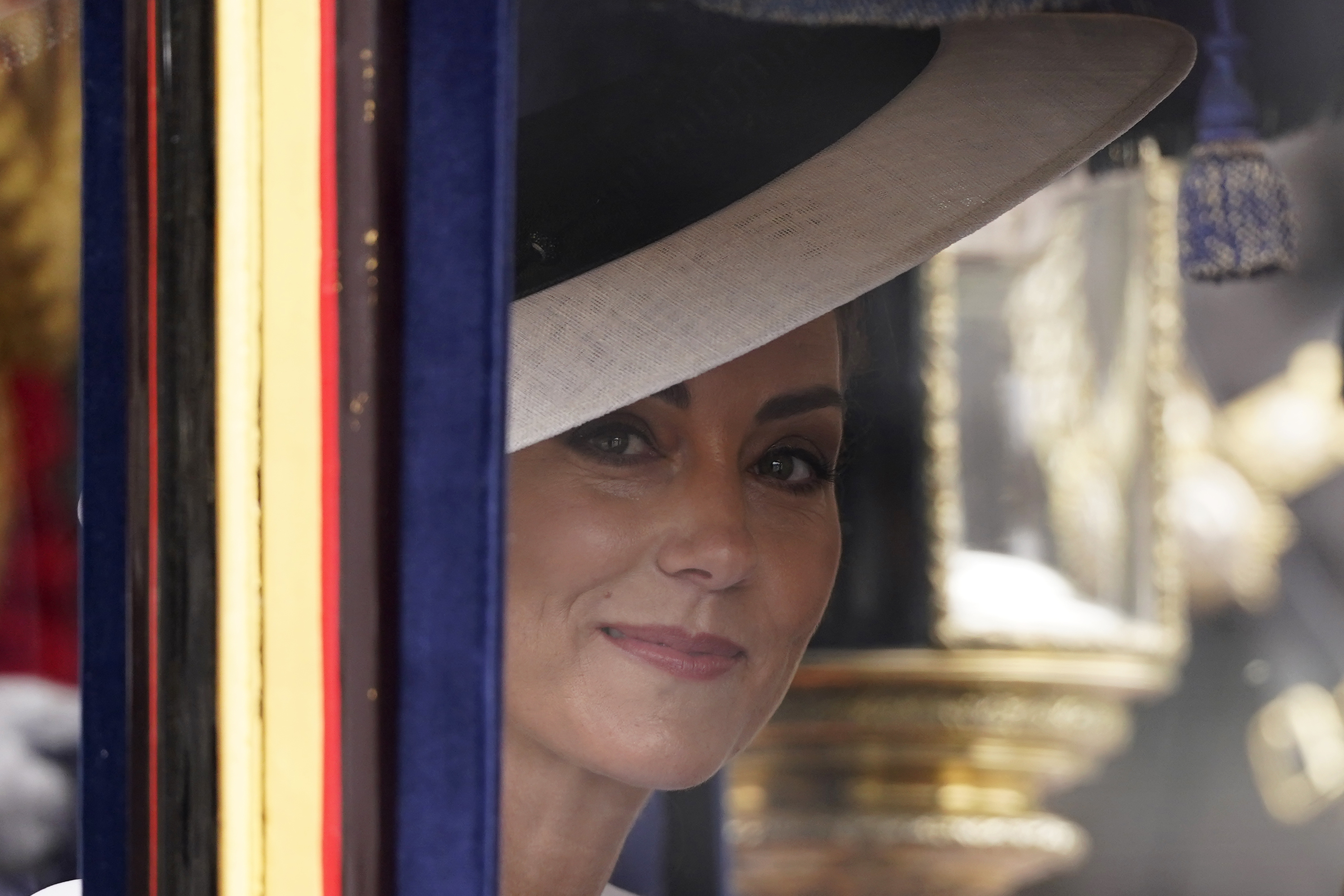 Kate, Princess of Wales looks out from her carriage as she travel to attend the Trooping the Color ceremony, in London, Saturday, June 15, 2024. Trooping the Color is the King's Birthday Parade and one of the nation's most impressive and iconic annual events attended by almost every member of the Royal Family. (AP Photo/Alberto Pezzali)