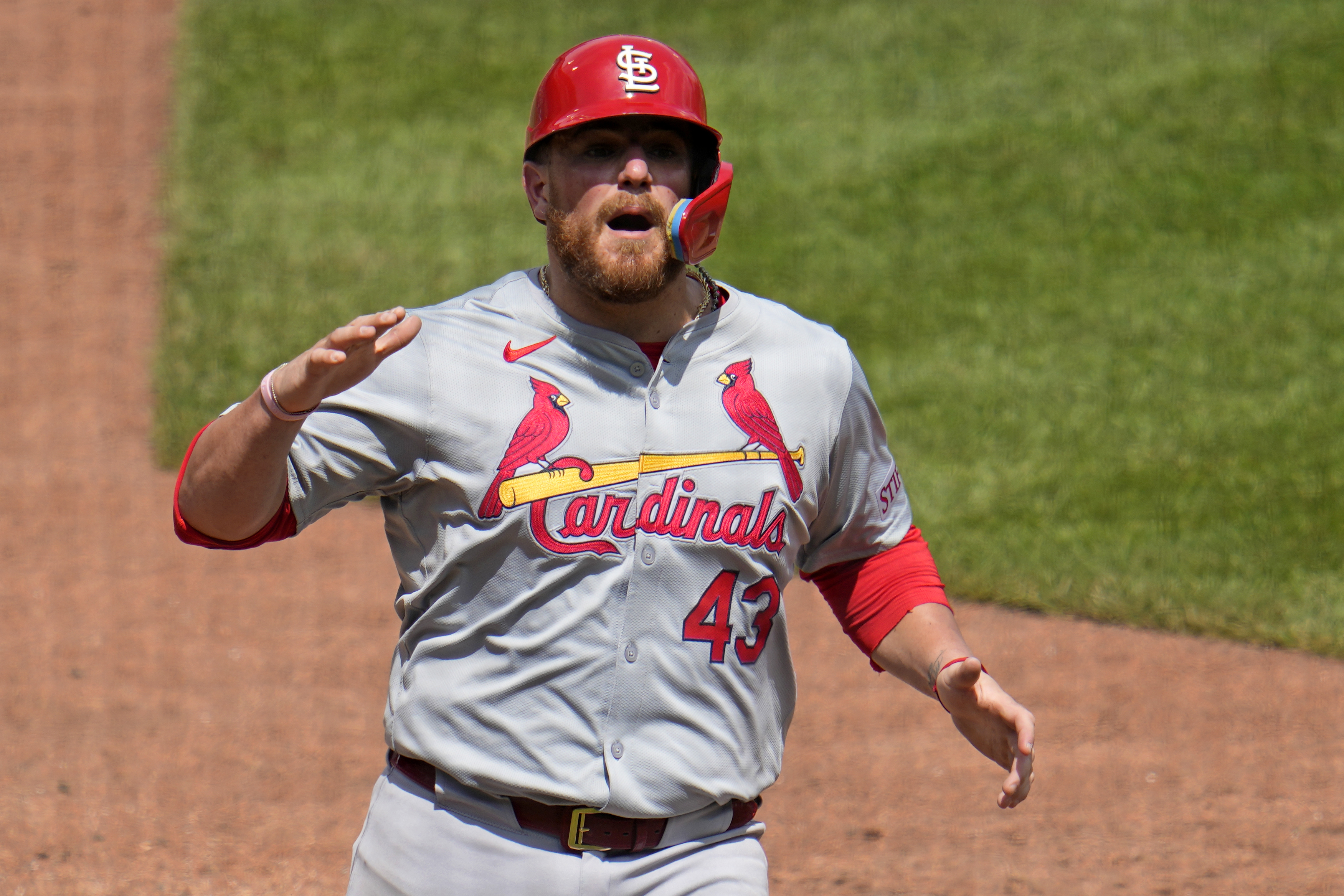 St. Louis Cardinals' Pedro Pagés returns to the dugout after scoring on a single by Alec Burleson off Pittsburgh Pirates relief pitcher Dennis Santana during the tenth inning of a baseball game in Pittsburgh, Thursday, July 4, 2024. The Cards won 3-2 in ten innings. (AP Photo/Gene J. Puskar)