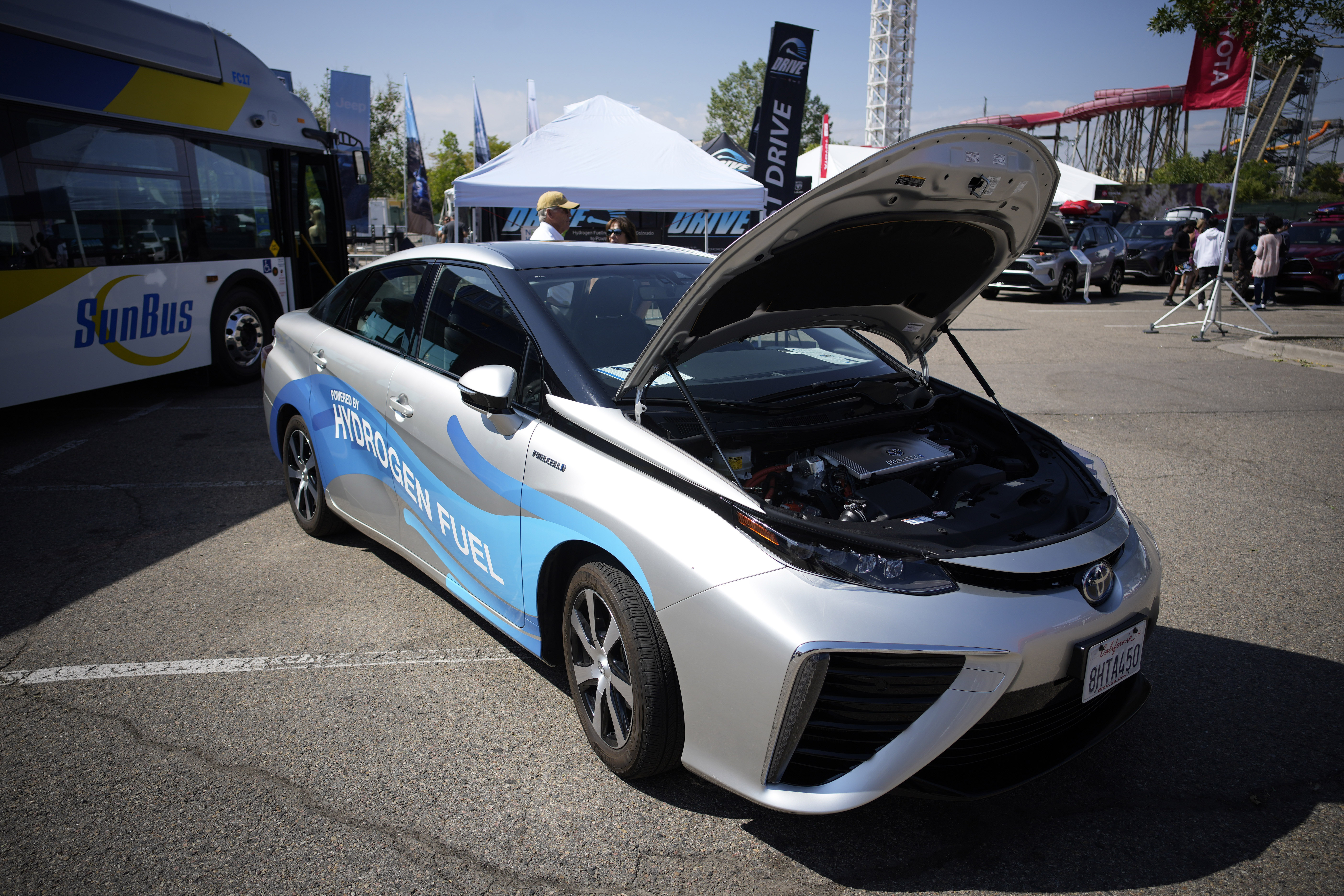 FILE - A 2021 Toyota Prius that runs on a hydrogen fuel cell sits on display at the Denver auto show on Sept. 17, 2021, at Elitch's Gardens in downtown Denver. California will be the first state to receive federal funds under a program to create regional networks, or "hubs," that produce hydrogen as an energy source for vehicles, manufacturing and generating electricity, officials announced Wednesday, July 17, 2024. (AP Photo/David Zalubowski, File)