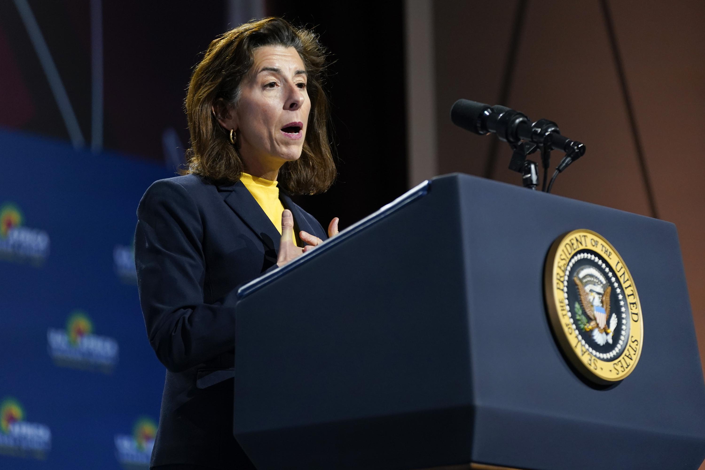 FILE - Commerce Secretary Gina Raimondo speaks before President Joe Biden to African leaders gathered for the U.S.-Africa Leaders Summit Dec. 14, 2022, in Washington. The government's $52 billion investment to develop advanced computer chips has become a rare source of bipartisan agreement. Senate Republican leader Mitch McConnell voted for it because of its importance for national security. But Raimondo says the U.S. needs a whole-of-society effort for the investments to succeed. (AP Photo/Patrick Semansky, File)