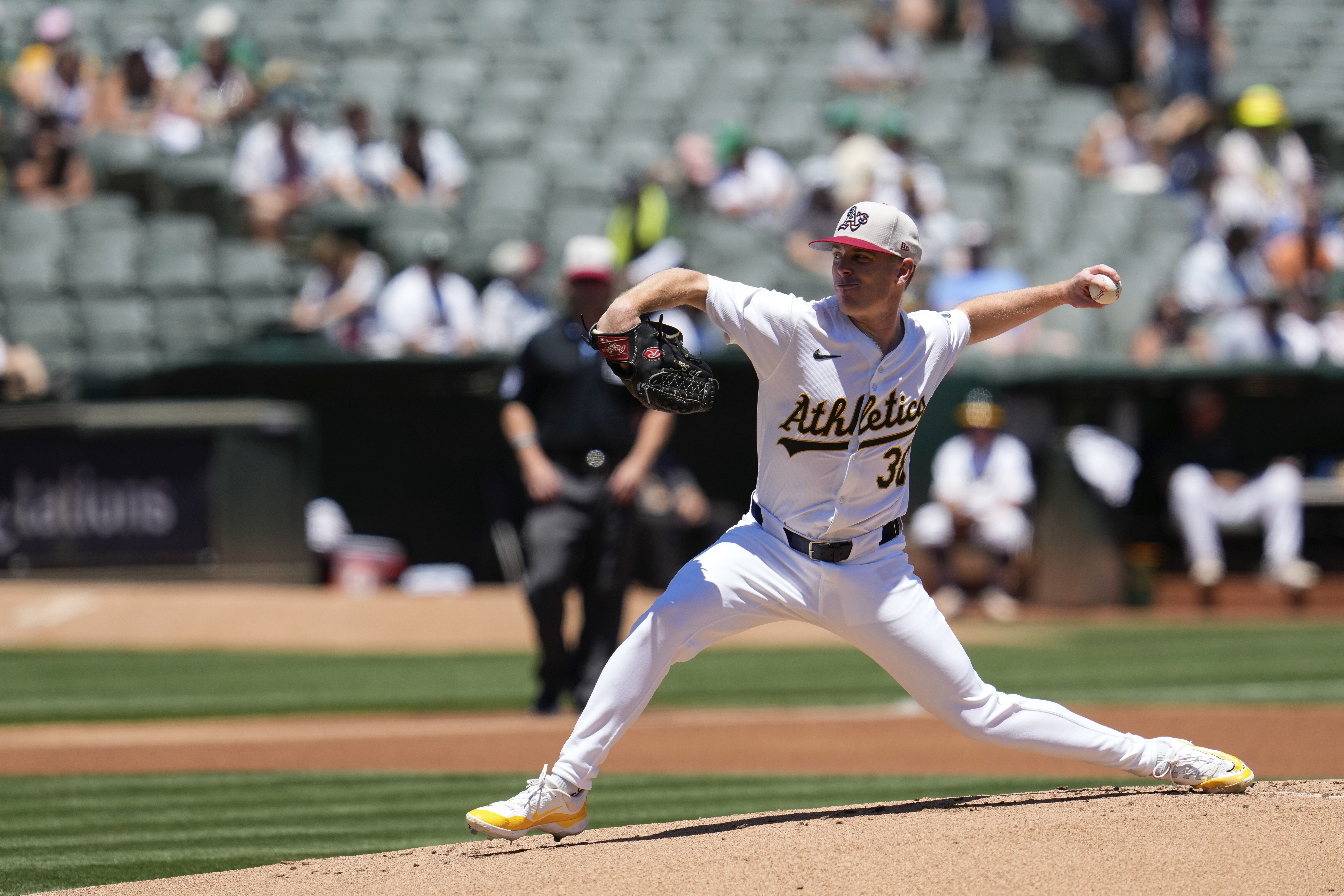 Oakland Athletics pitcher JP Sears throws to a Los Angeles Angels batter during the first inning of a baseball game Thursday, July 4, 2024, in Oakland, Calif. (AP Photo/Godofredo A. Vásquez)