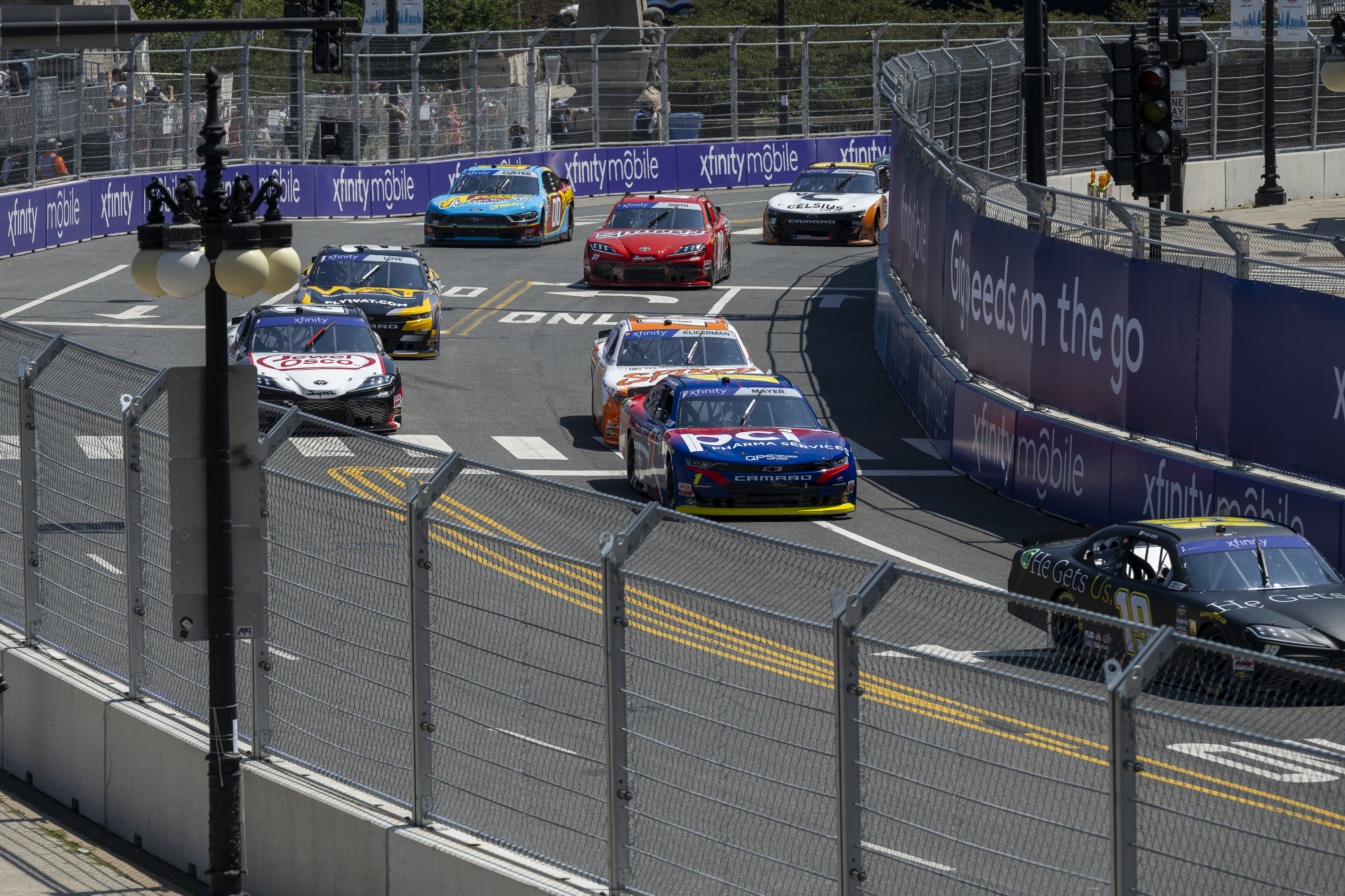 Cars navigate turn 19 during a NASCAR Xfinity Series street course auto race in Grant Park, Saturday, July 6, 202 4 in Chicago. (Tyler Pasciak LaRiviere/Chicago Sun-Times via AP)