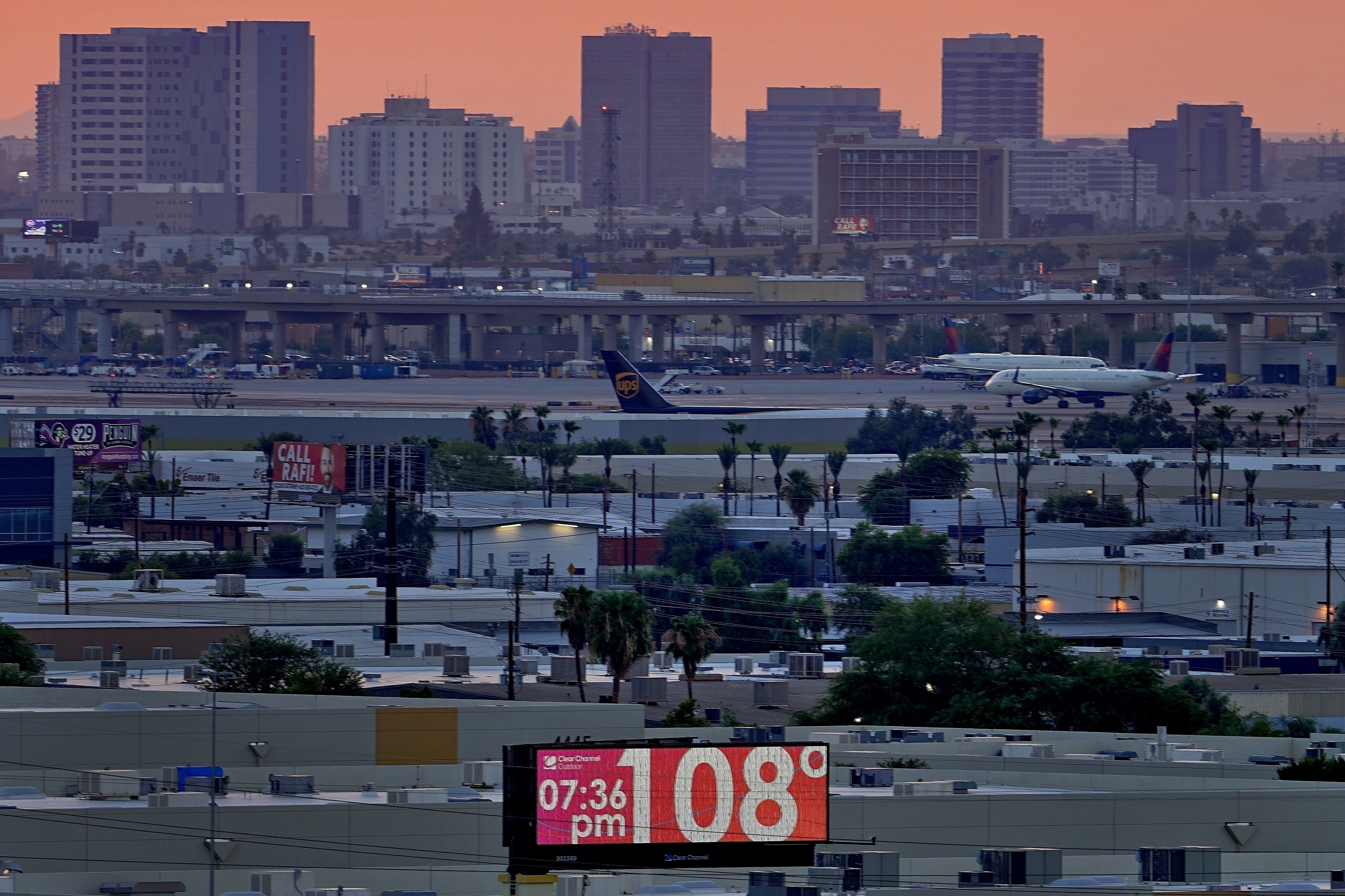 FILE - The unofficial temperature hits 108 degrees at dusk at Sky Harbor International Airport in Phoenix, on July 12, 2023. The U.S. last year saw the most heat waves since 1936, according to an Associated Press analysis of Centers for Disease Control and Prevention data. (AP Photo/Matt York, File)