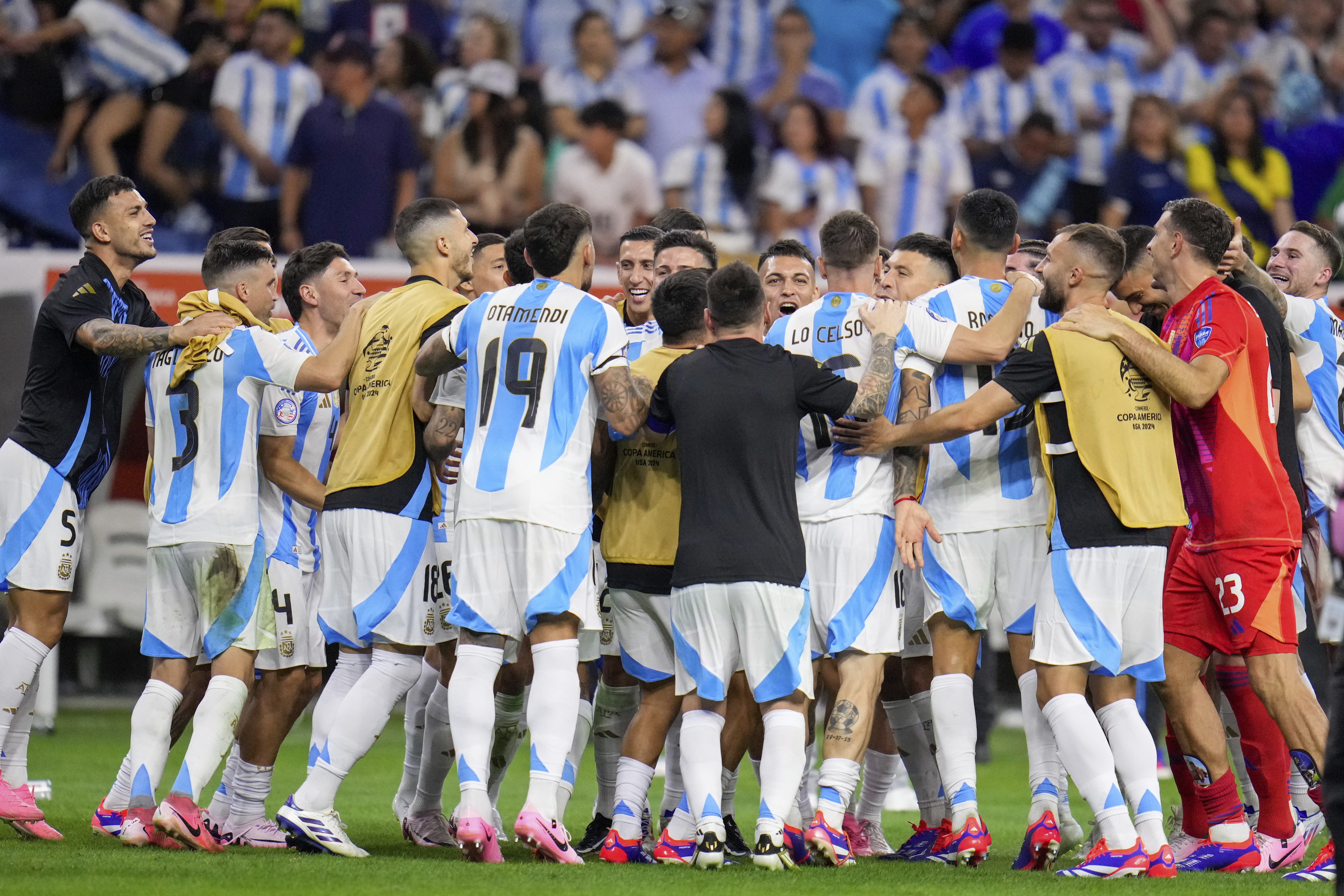 Players of Argentina celebrate defeating Ecuador in a penalty shootout in a Copa America quarterfinal soccer match in Houston, Thursday, July 4, 2024. (AP Photo/Julio Cortez)