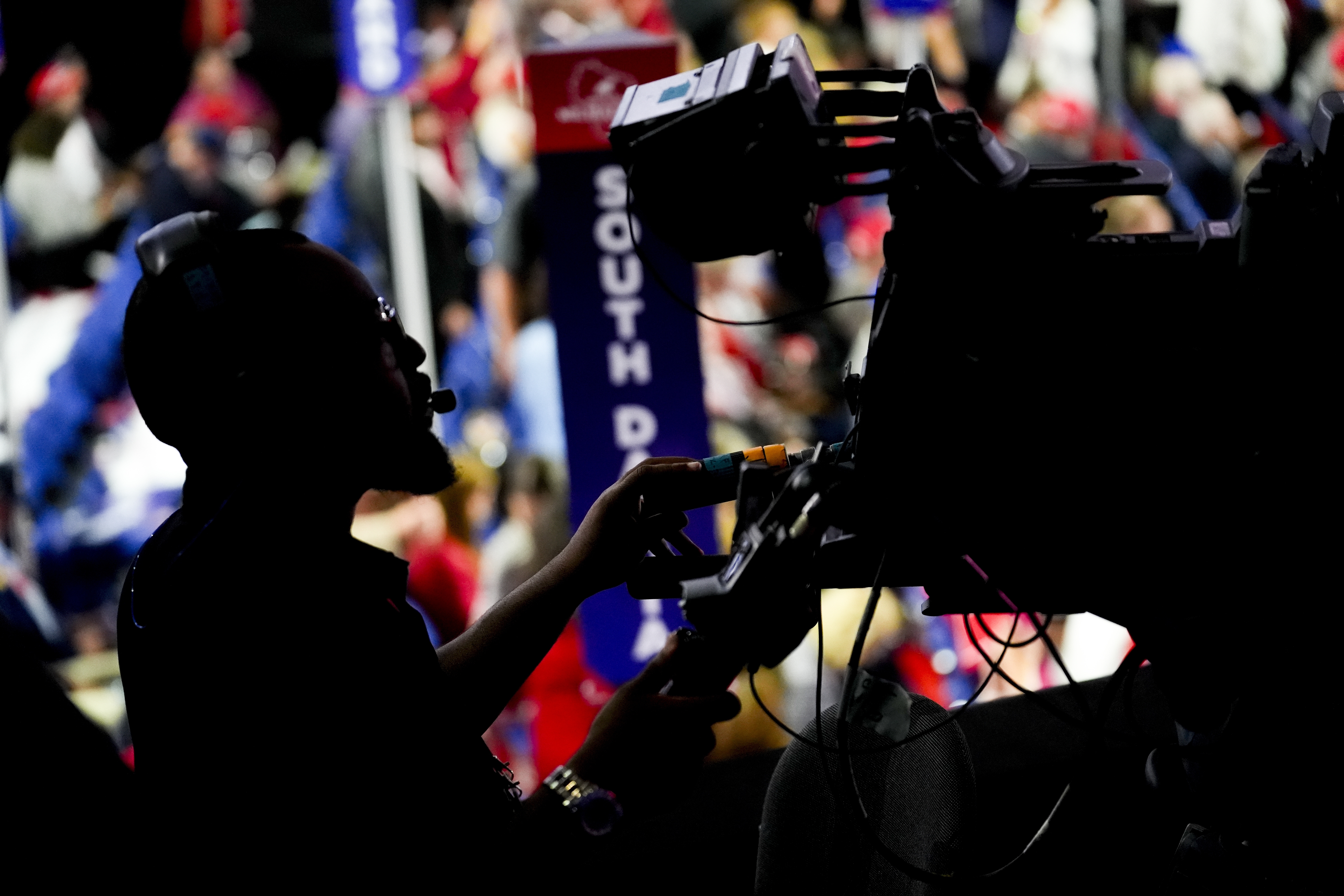 A television camera operator is seen during the Republican National Convention Tuesday, July 16, 2024, in Milwaukee. (AP Photo/Charles Rex Arbogast)