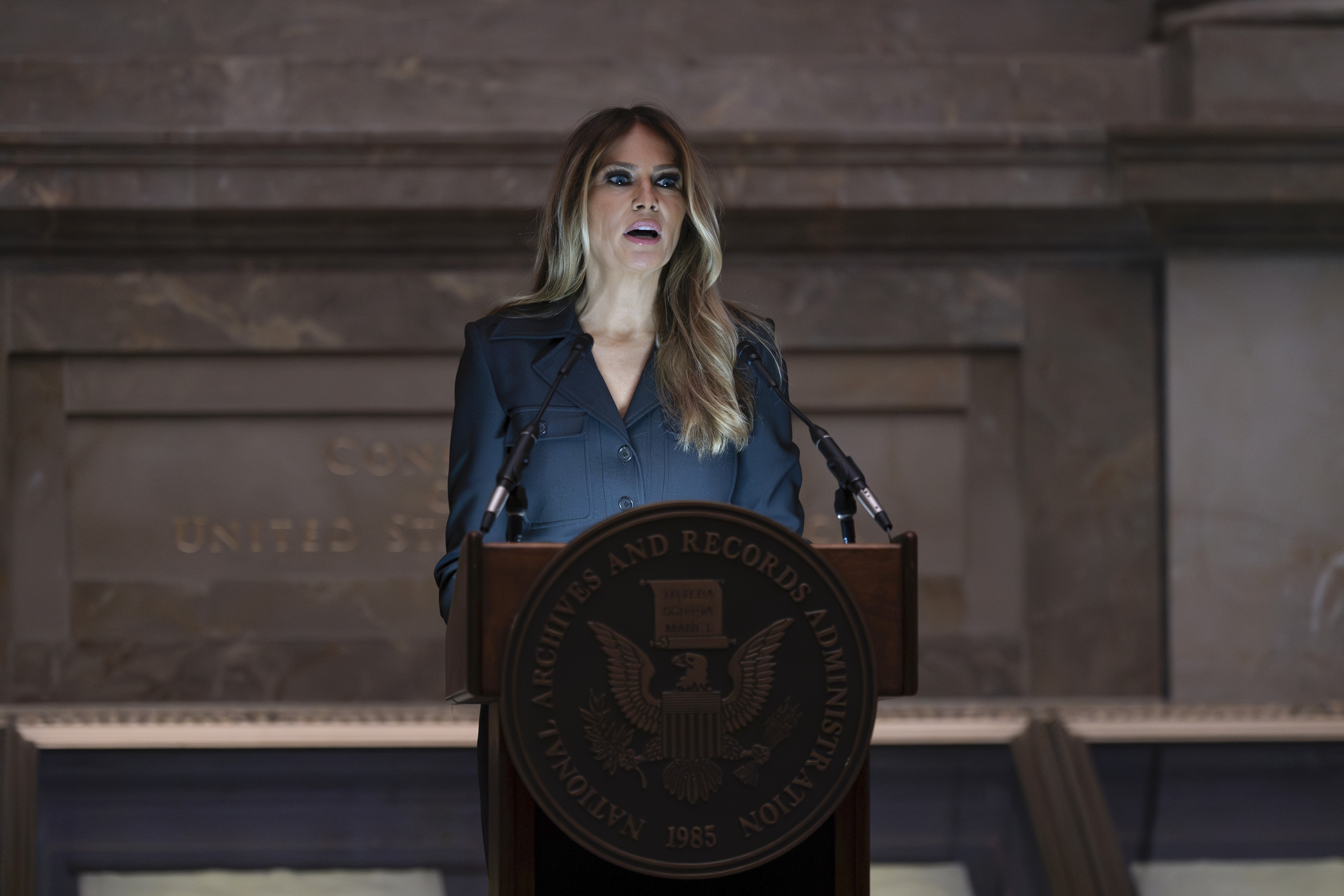 Former first lady Melania Trump welcomes newly-sworn American citizens as the National Archives holds a naturalization ceremony with 25 people from 25 nations, in Washington, Friday, Dec. 15, 2023. (AP Photo/J. Scott Applewhite)