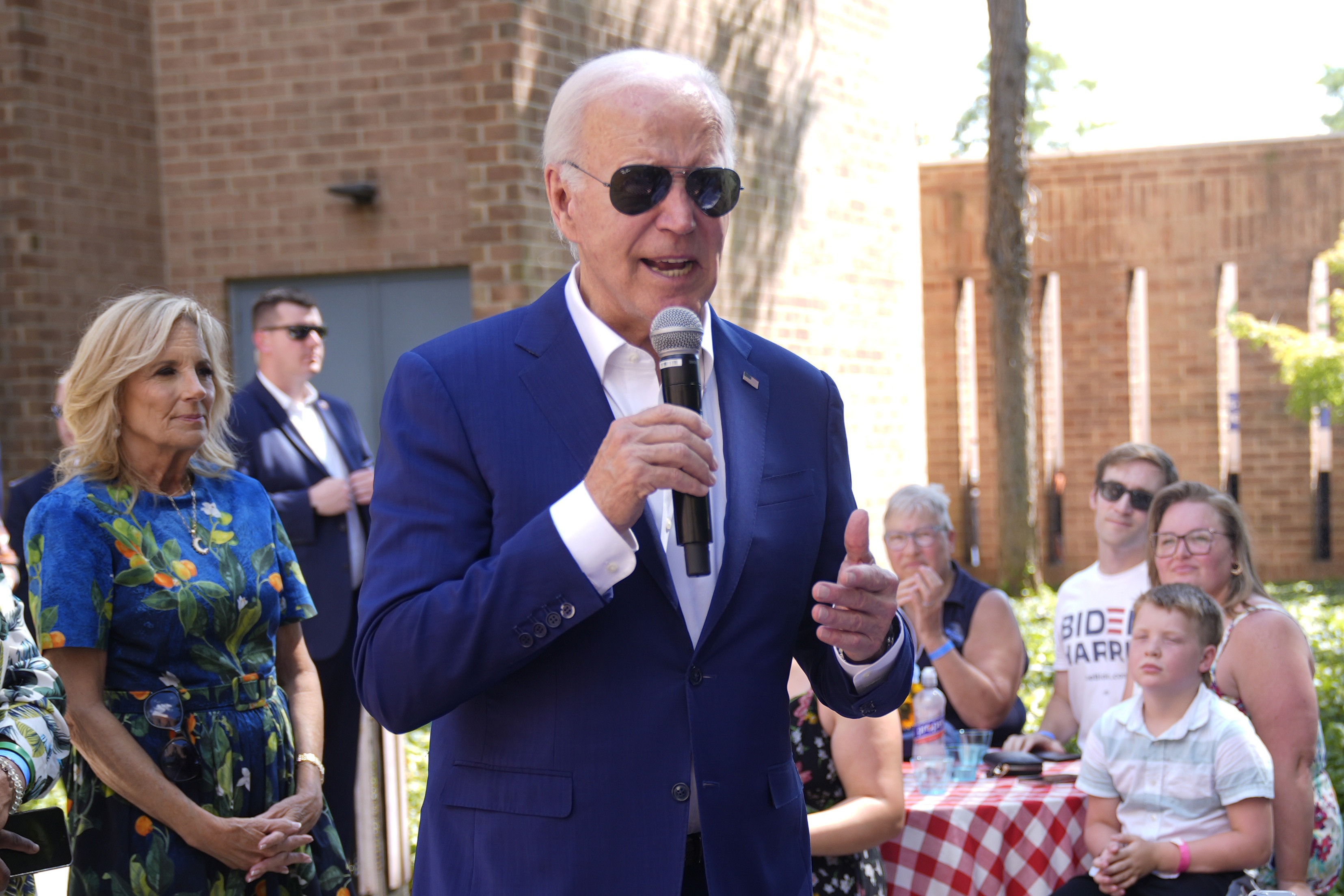 President Joe Biden speaks to supporters as first lady Jill Biden, left, looks on at a campaign rally in Harrisburg, Pa., on Sunday, July 7, 2024. (AP Photo/Manuel Balce Ceneta)