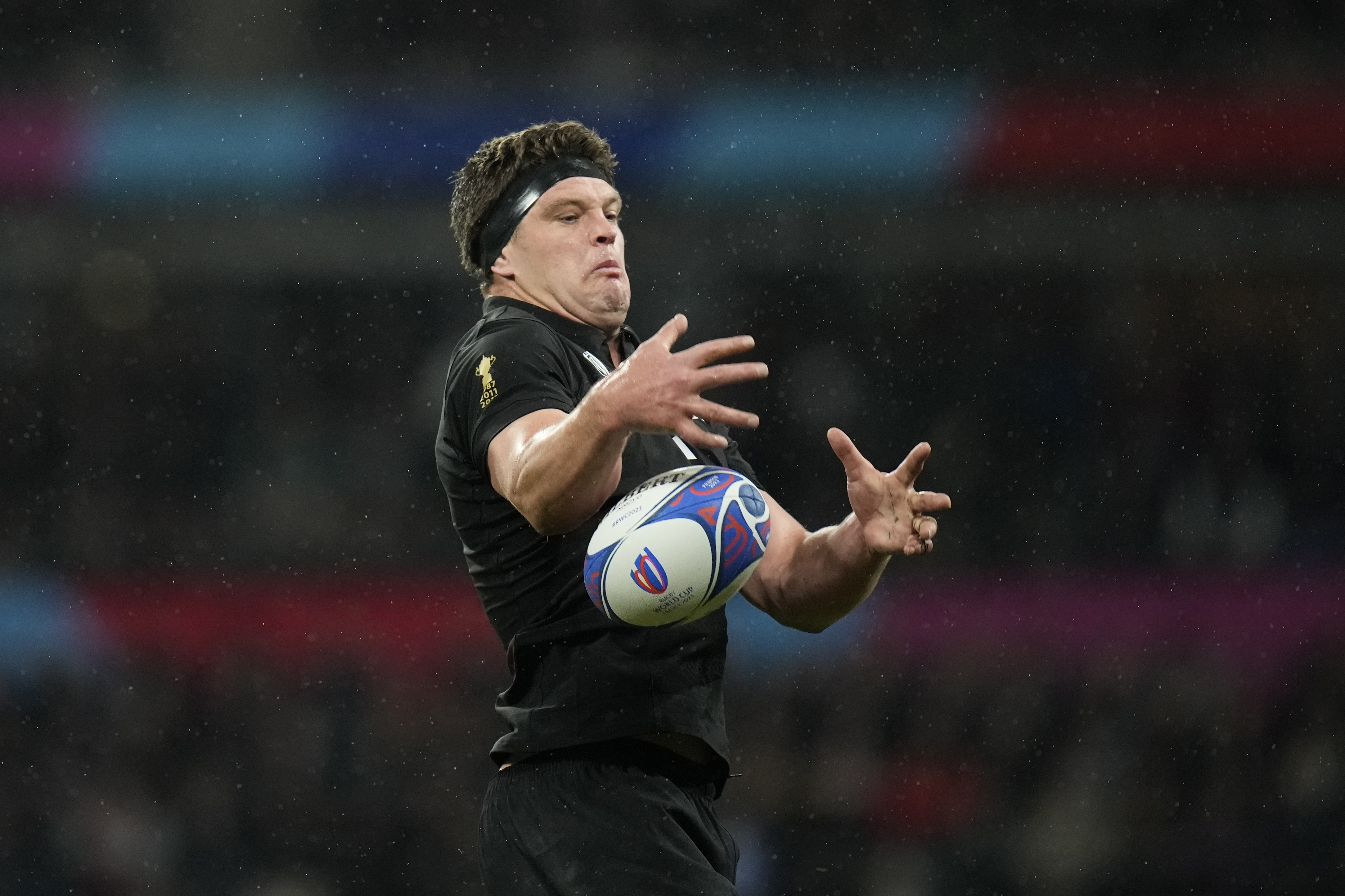 FILE- New Zealand's Scott Barrett takes the ball in a line out during the Rugby World Cup final match between New Zealand and South Africa at the Stade de France in Saint-Denis, near Paris, Oct. 28, 2023. New All Blacks head coach Scott Robertson has chosen Scott Barrett as his first captain, to lead a 32-man squad he named Monday in tests against England and Fiji. (AP Photo/Christophe Ena, File)