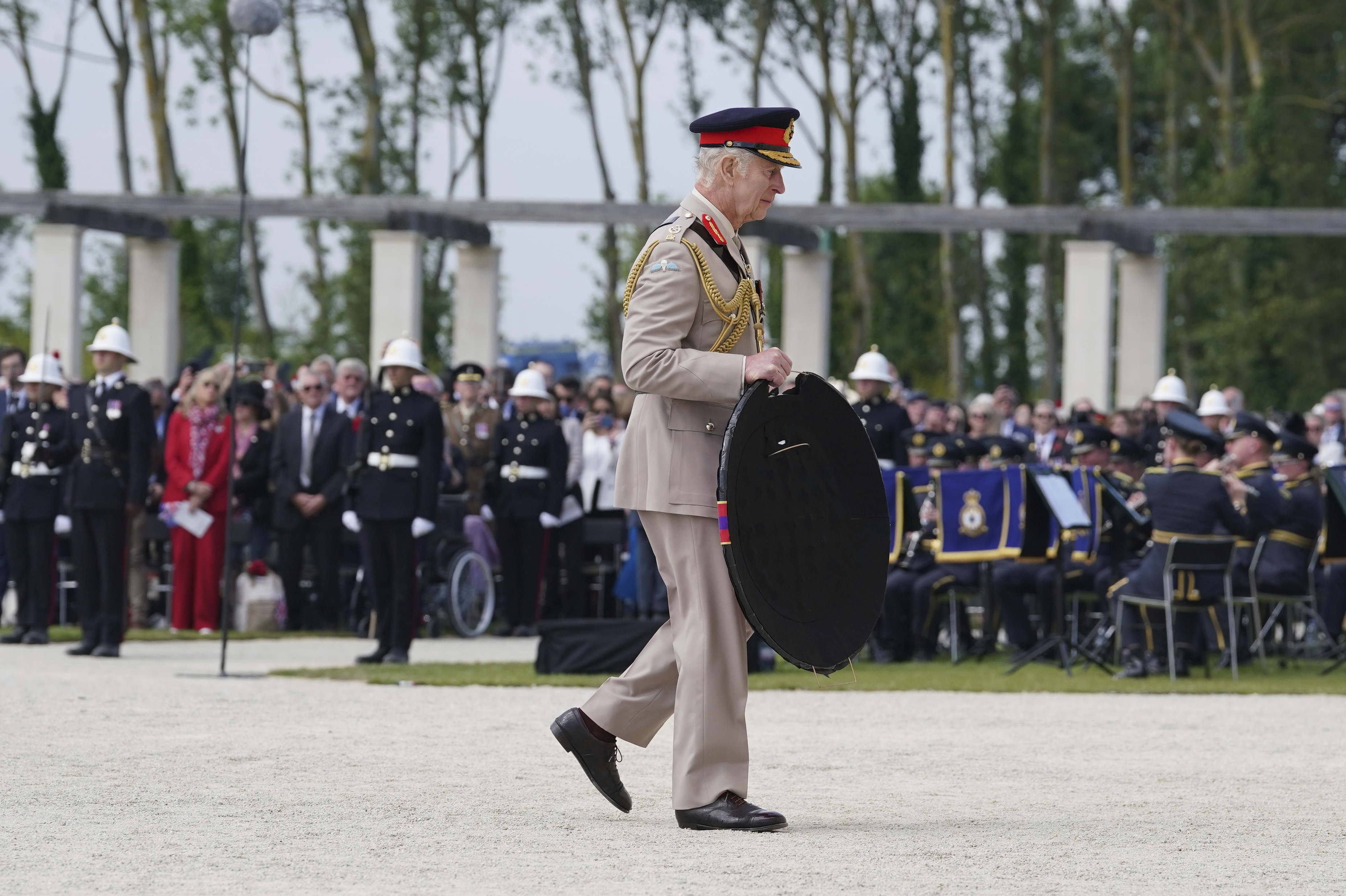 King Charles III lays a wreath during the UK national commemorative event for the 80th anniversary of D-Day, held at the British Normandy Memorial in Ver-sur-Mer, Normandy, France, Thursday June 6, 2024. (Gareth Fuller, Pool Photo via AP)