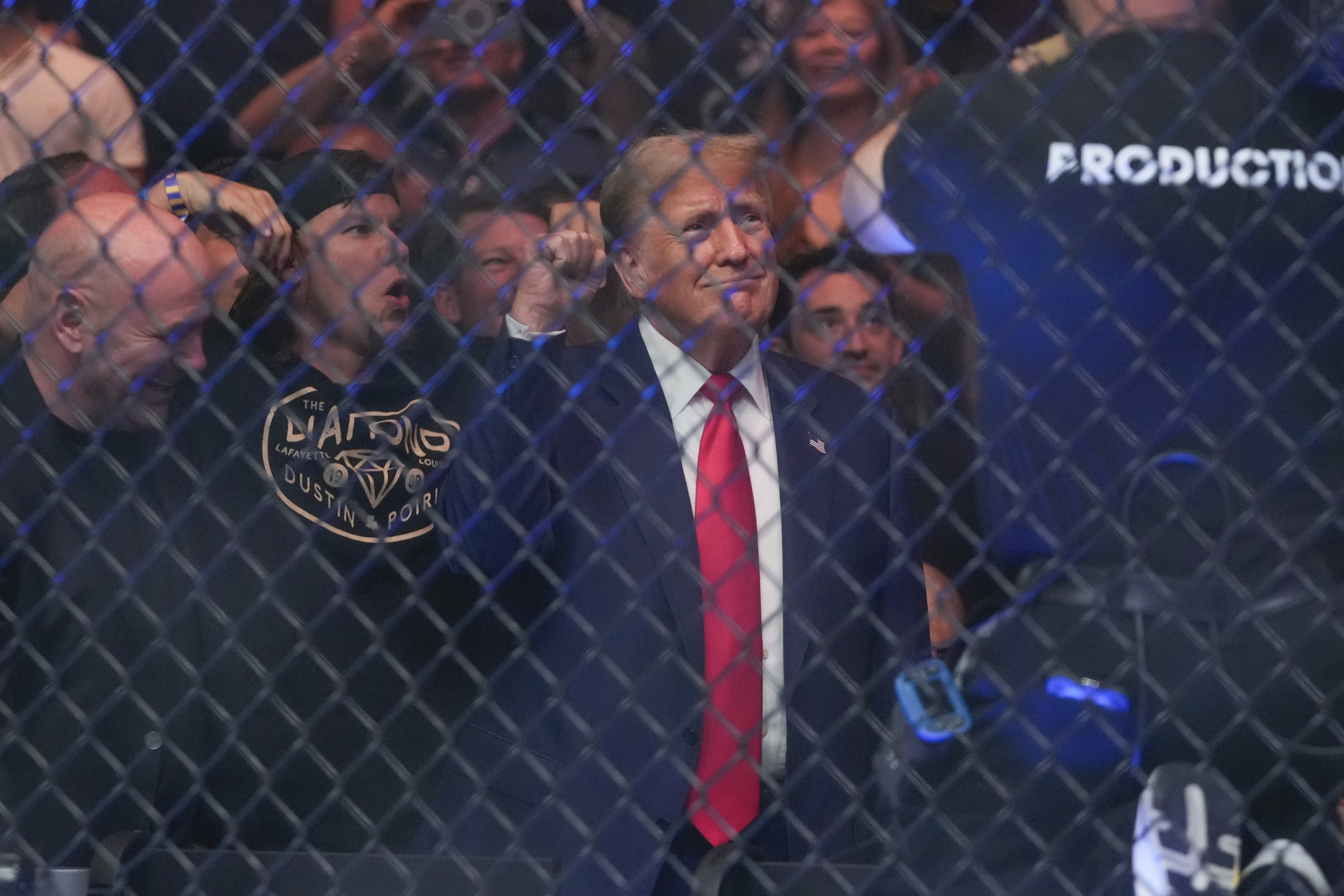 Former President Donald Trump gestures while attending the UFC 302 mixed martial arts event Saturday, June 1, 2024, in Newark, N.J. (AP Photo/Frank Franklin II)