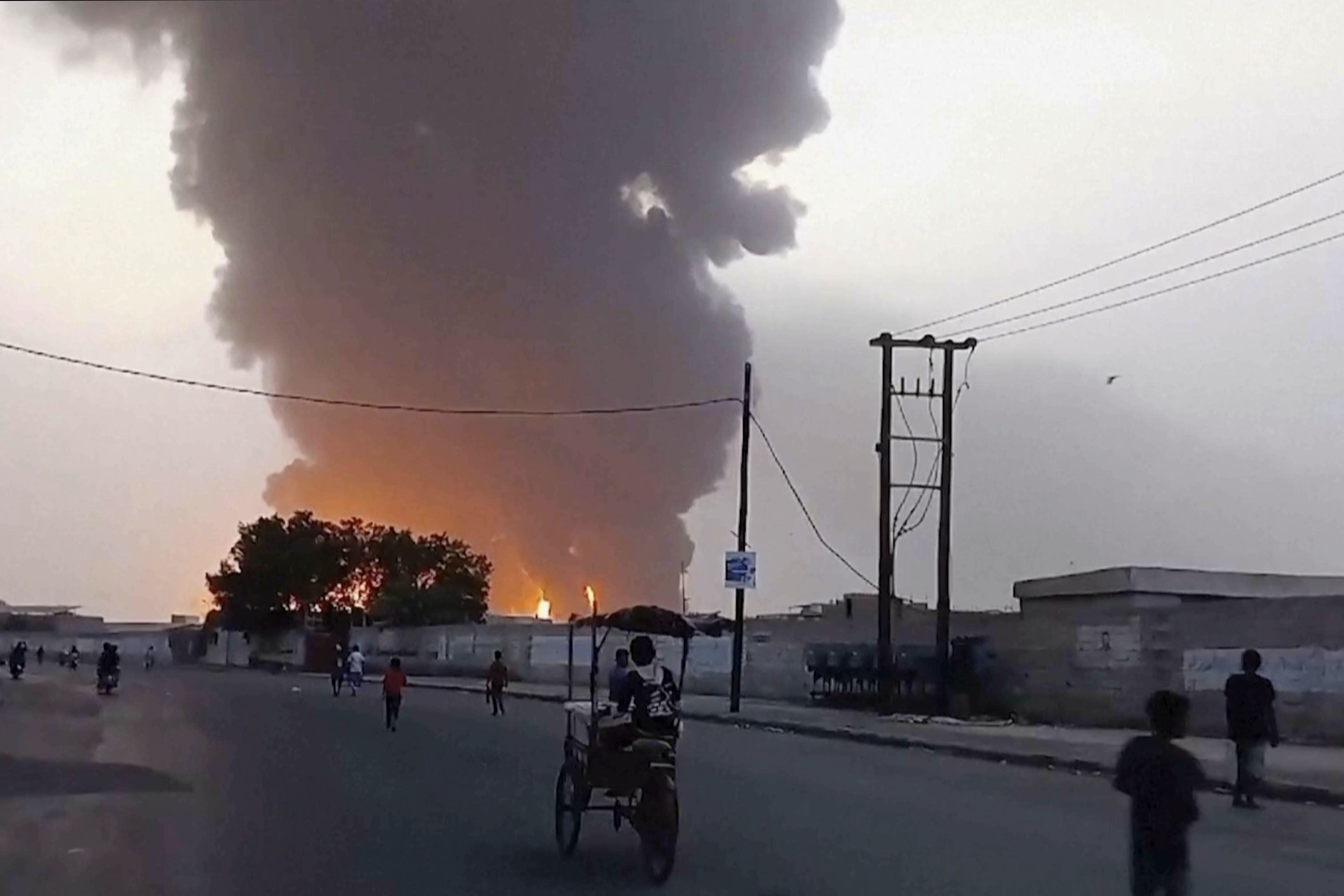 In this image from video, smoke and flames rise from a site in Hodeidah, Yemen, on Saturday, July 20, 2024. The Israeli army says it struck several Houthi targets in western Yemen following a fatal drone attack by the rebel group in Tel Aviv the previous day. (AP Photo)