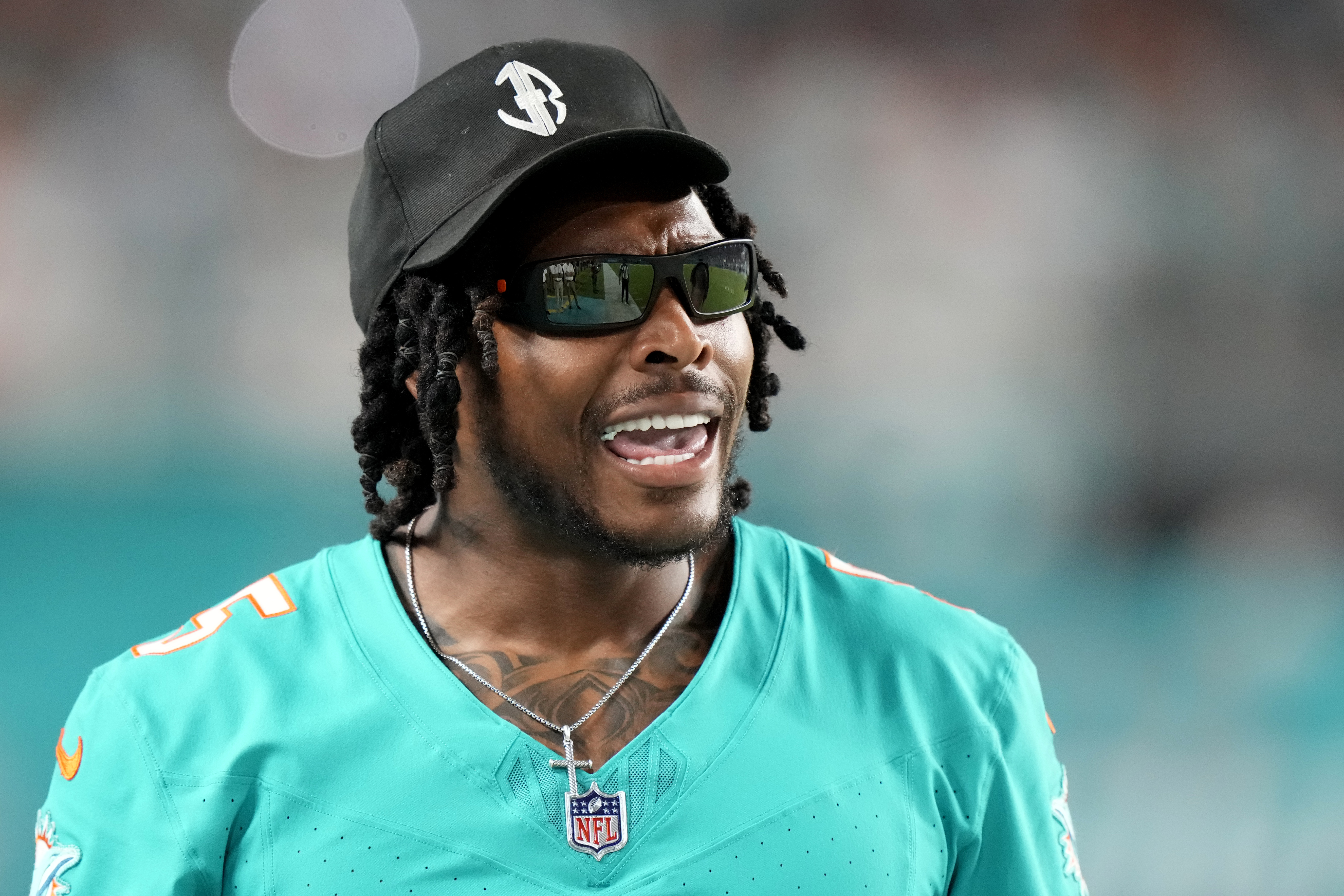 Miami Dolphins cornerback Jalen Ramsey watches from the sideline during the second half of a preseason NFL football game against the Washington Commanders, Saturday, Aug. 17, 2024, in Miami Gardens, Fla. (AP Photo/Wilfredo Lee)