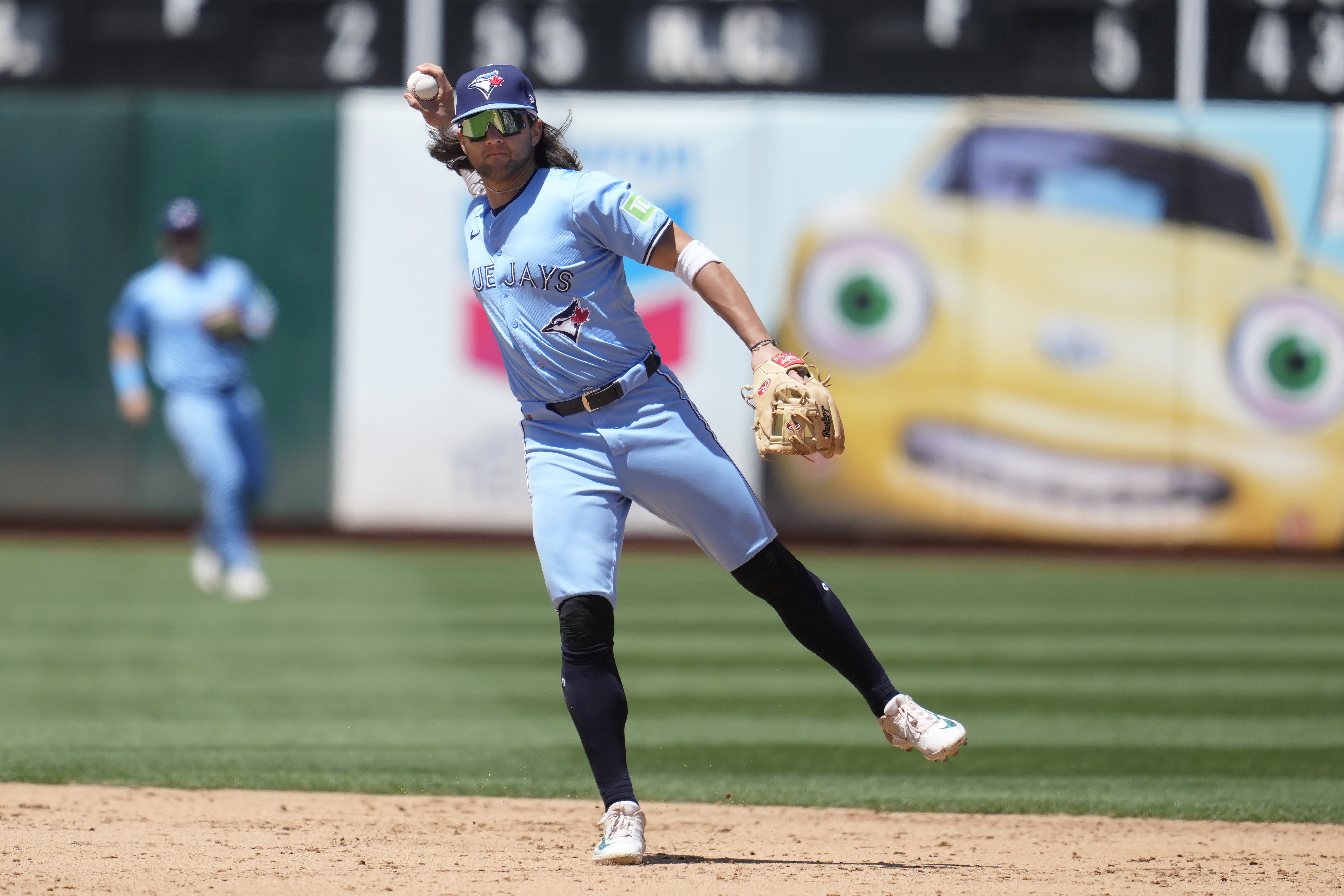 Toronto Blue Jays shortstop Bo Bichette throws out Oakland Athletics' JJ Bleday at first base during the sixth inning of a baseball game in Oakland, Calif., Sunday, June 9, 2024. (AP Photo/Jeff Chiu)