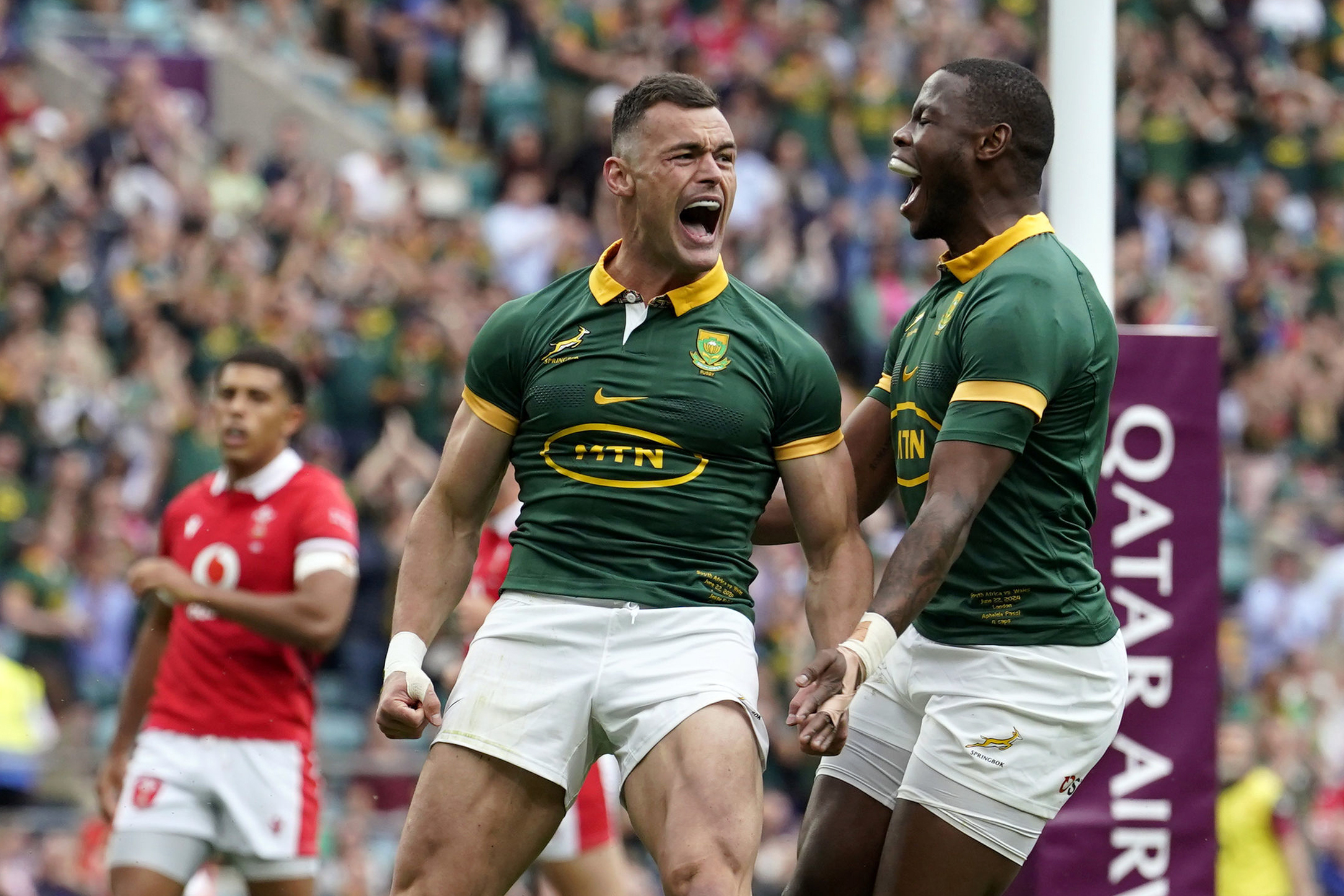 South Africa's Jesse Kriel, left, celebrates scoring during the rugby union cup match between Wales and South Africa at Twickenham Stadium, London, Saturday June 22, 2024. (Andrew Matthews/PA via AP)