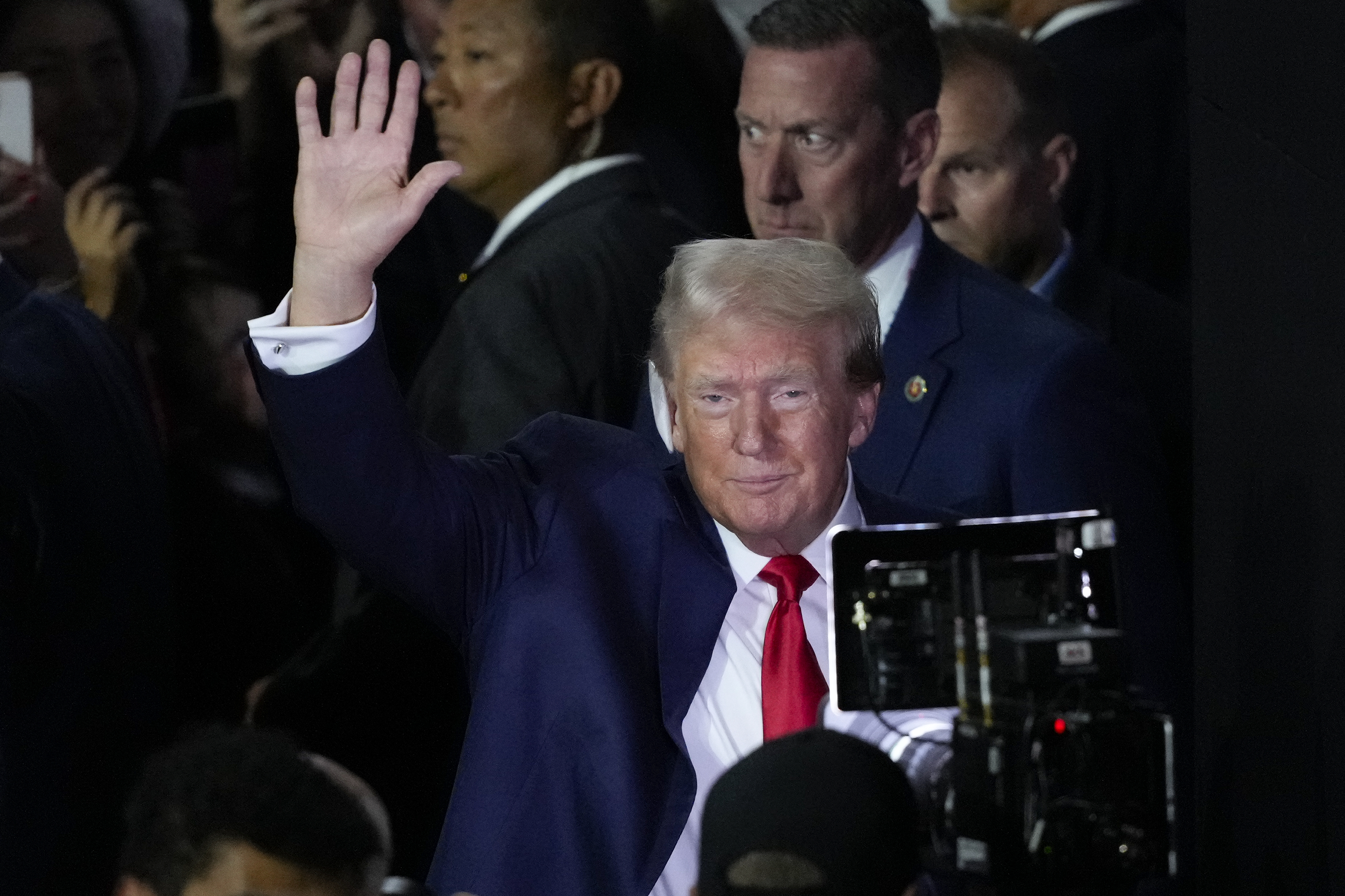 Republican presidential candidate former President Donald Trump waves to supporters as he arrives to the first day of the Republican National Convention Monday, July 15, 2024, in Milwaukee. (AP Photo/J. Scott Applewhite)