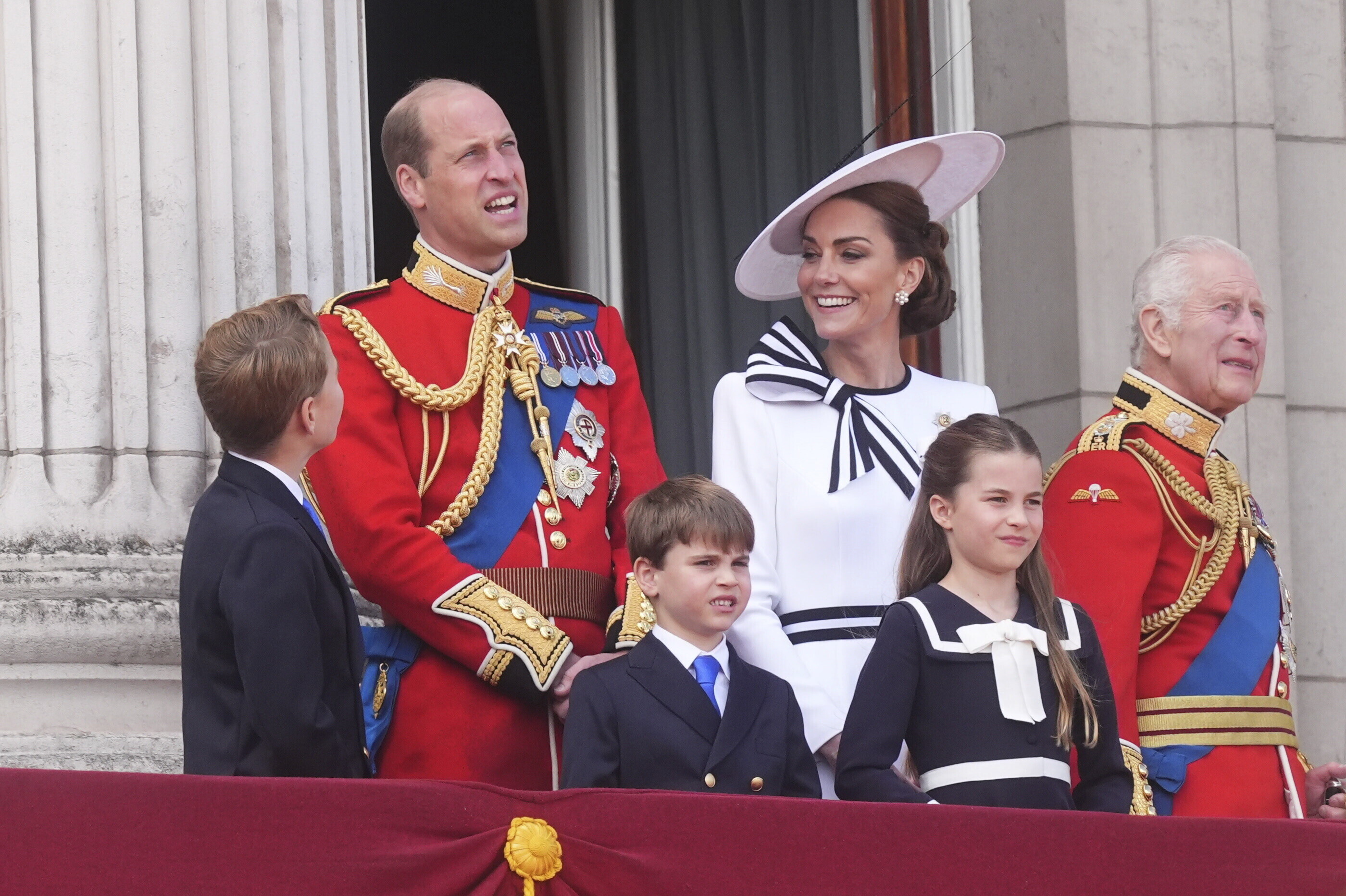 From left, Britain's Prince George, Prince William, Prince Louis, Kate, Princess of Wales, Princess Charlotte and King Charles III on the balcony of Buckingham Palace to view the flypast following the Trooping the Color ceremony in London, Saturday, June 15, 2024. (James Manning/PA via AP)