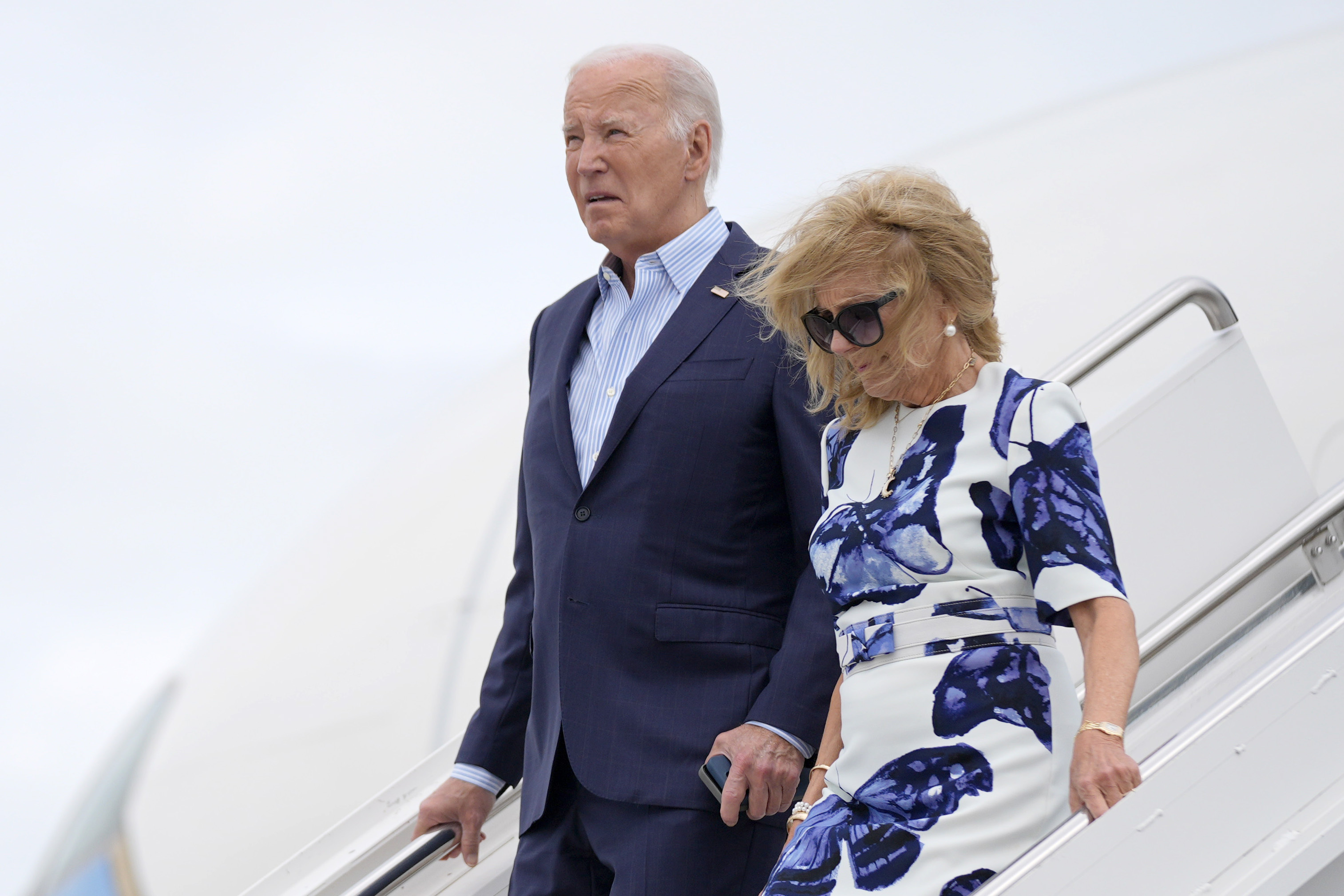 President Joe Biden, left, and first lady Jill Biden arrive at Francis S. Gabreski Airport, Saturday, June 29, 2024, in Westhampton Beach, N.Y. (AP Photo/Evan Vucci)