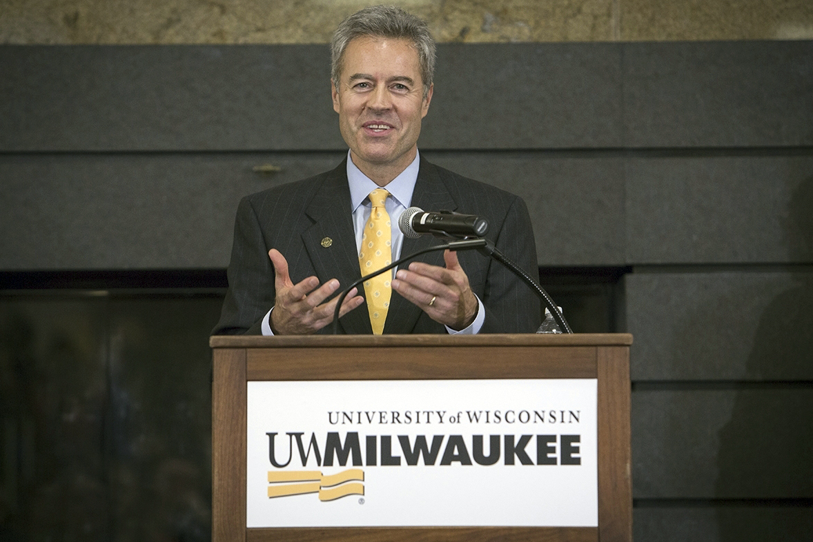 FILE - In this image provided by University of Wisconsin-Milwaukee, Mark Mone speaks at a press conference in the student union at the University of Wisconsin-Milwaukee on Monday, Dec. 15, 2014 in Milwaukee, Wis. University of Wisconsin-Milwaukee Chancellor Mark Mone announced Wednesday, July 3, 2204, that he plans to step down next year and transition to a teaching role as the UW system continues to struggle financially. (Derek Rickert/University of Wisconsin-Milwaukee via AP, File)