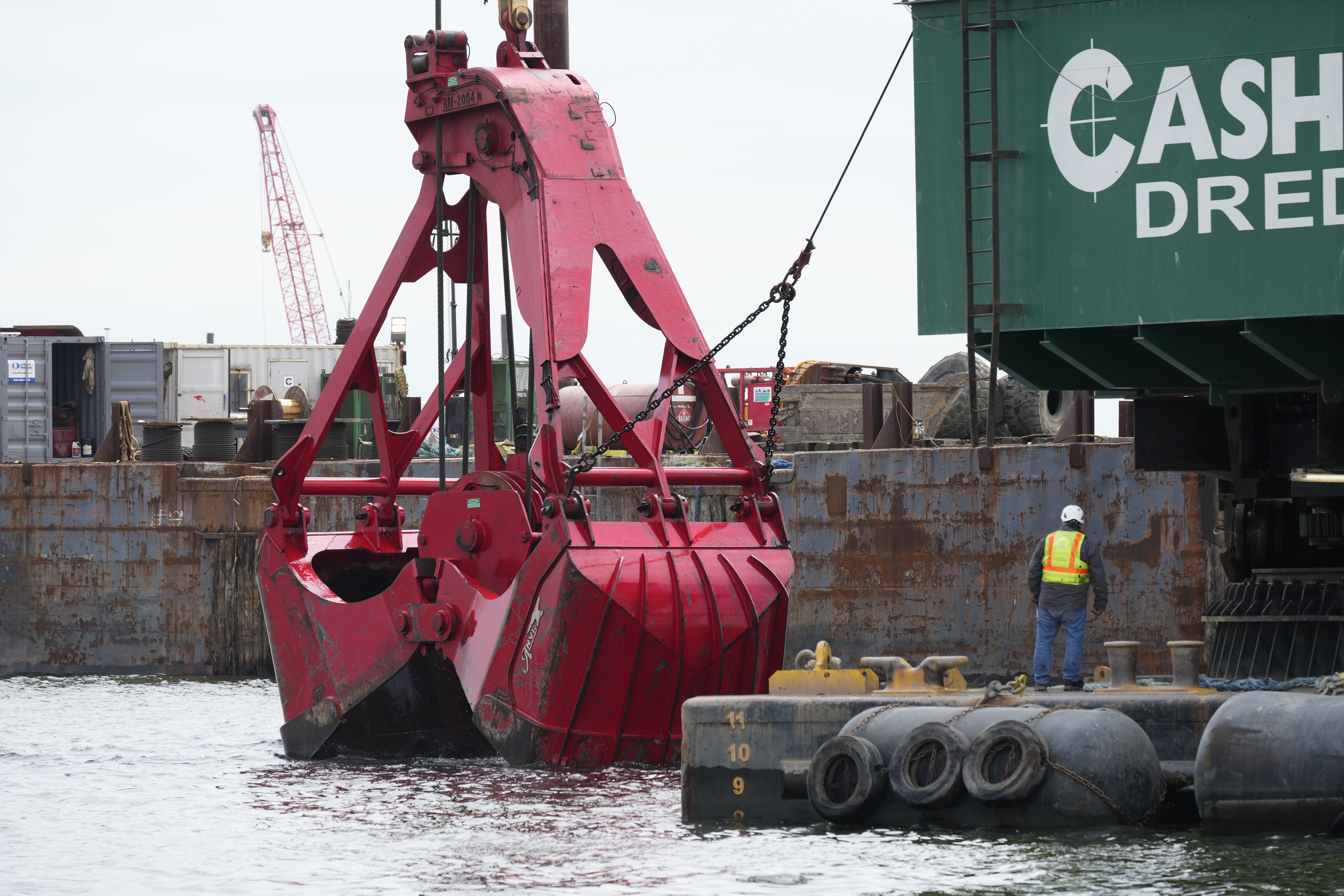 FILE - Workers remove wreckage of the collapsed Francis Scott Key Bridge, April 25, 2024, in Baltimore. A Maryland board led by Gov. Wes Moore approved a $50.3 million emergency contract on Wednesday, July 3, 2024, with a company that removed debris from the March collapse of the Francis Scott Key Bridge. (AP Photo/Matt Rourke, File)