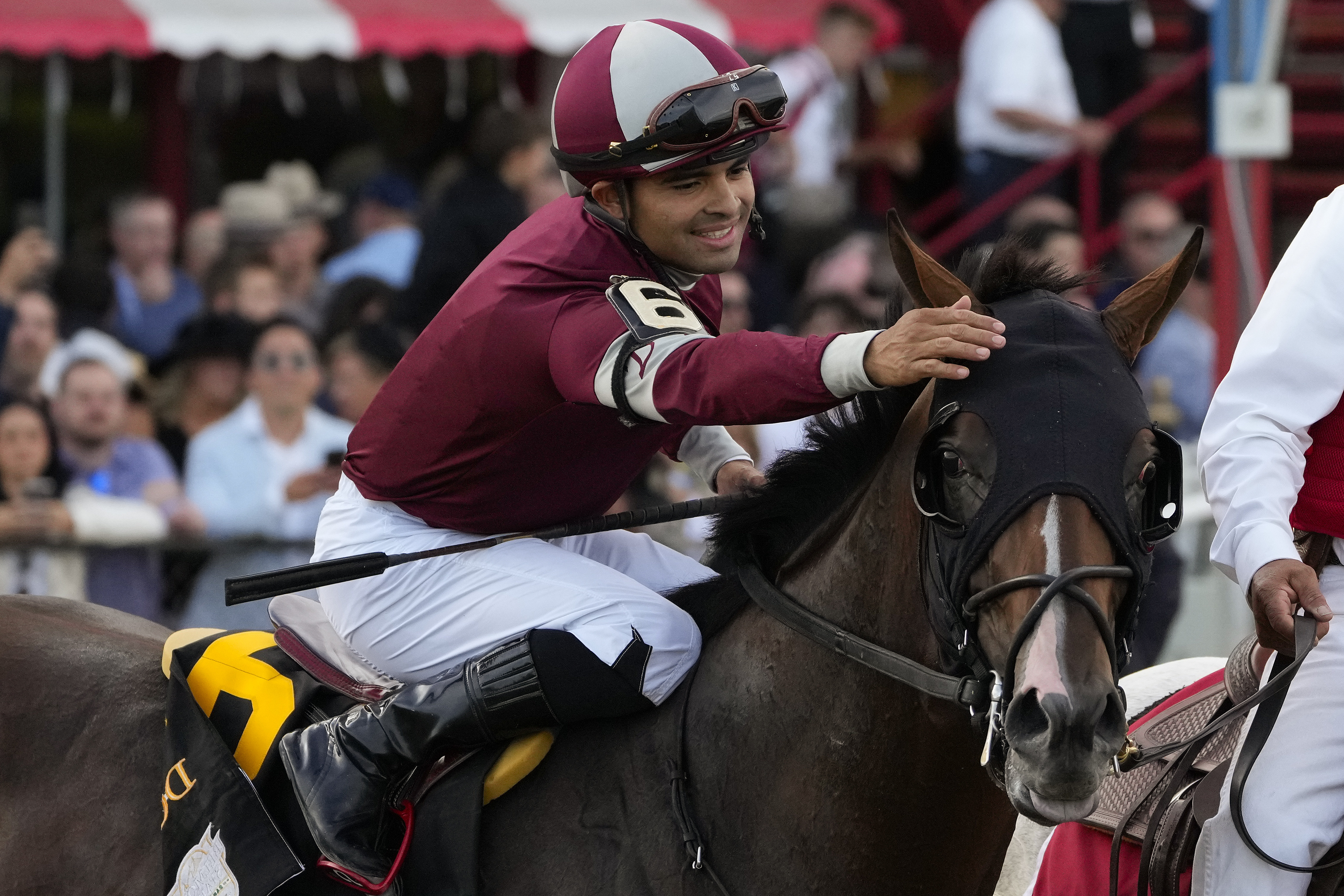 FILE - Jockey Luis Saez congratulates Dornoch (6) after winning the 156th running of the Belmont Stakes horse race, Saturday, June 8, 2024, in Saratoga Springs, N.Y. (AP Photo/Seth Wenig, File)