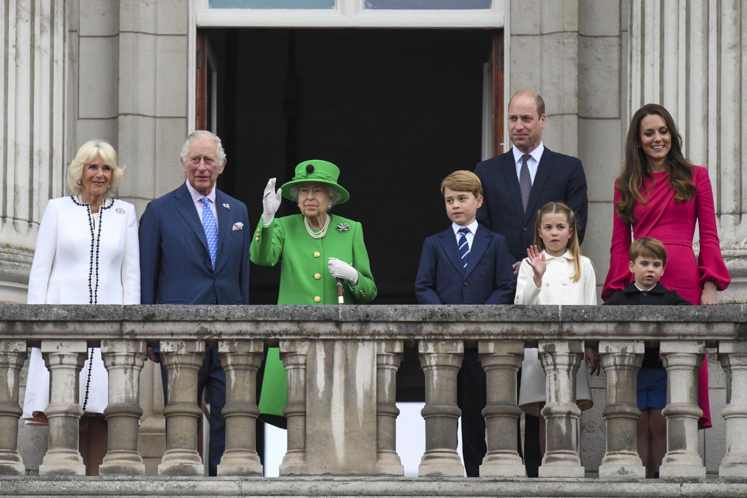 From left,  Camilla, Duchess of Cornwall Prince Charles, Queen Elizabeth II, Prince George, Prince William, Princess Charlotte, Prince Louis and Kate, Duchess of Cambridge stand on the balcony, at the end of the Platinum Jubilee Pageant held outside Buckingham Palace, in London, Sunday June 5, 2022, on the last of four days of celebrations to mark the Platinum Jubilee. The pageant will be a carnival procession up The Mall featuring giant puppets and celebrities that will depict key moments from Queen Elizabeth II’s seven decades on the throne. (Roland Hoskins/Pool Photo via AP)