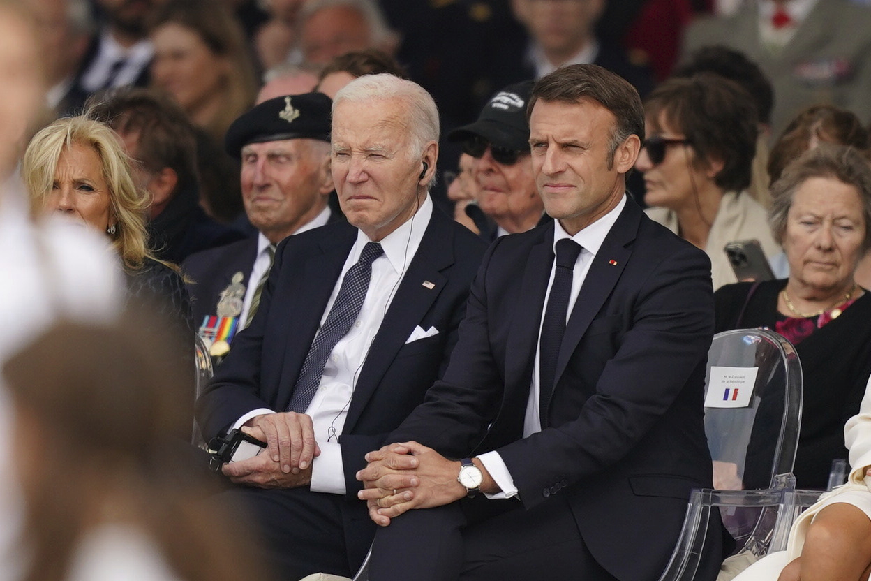 US President Joe Biden and President of France Emmanuel Macron attend the official international ceremony to mark the 80th anniversary of D-Day, at Omaha Beach in Saint-Laurent-sur-Mer, Normandy, France, Thursday, June 6, 2024. (Jordan Pettitt, Pool Photo via AP)